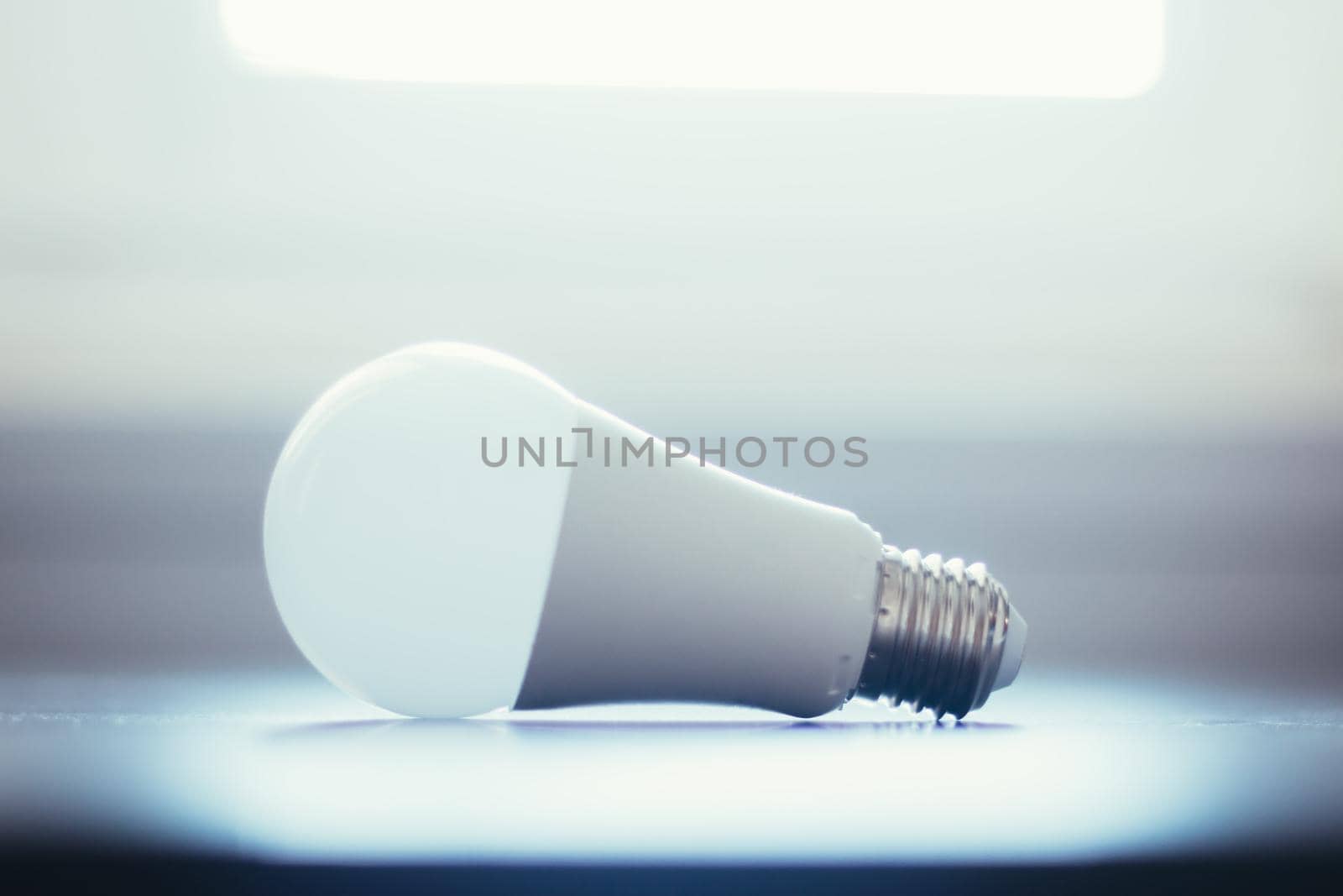 White light bulb lying on a desk, concept for ideas
