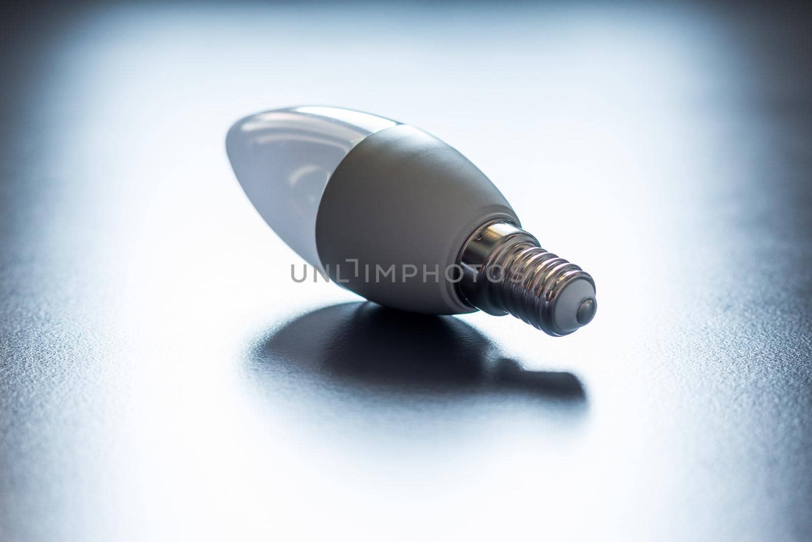 White light bulb lying on a desk, concept for ideas