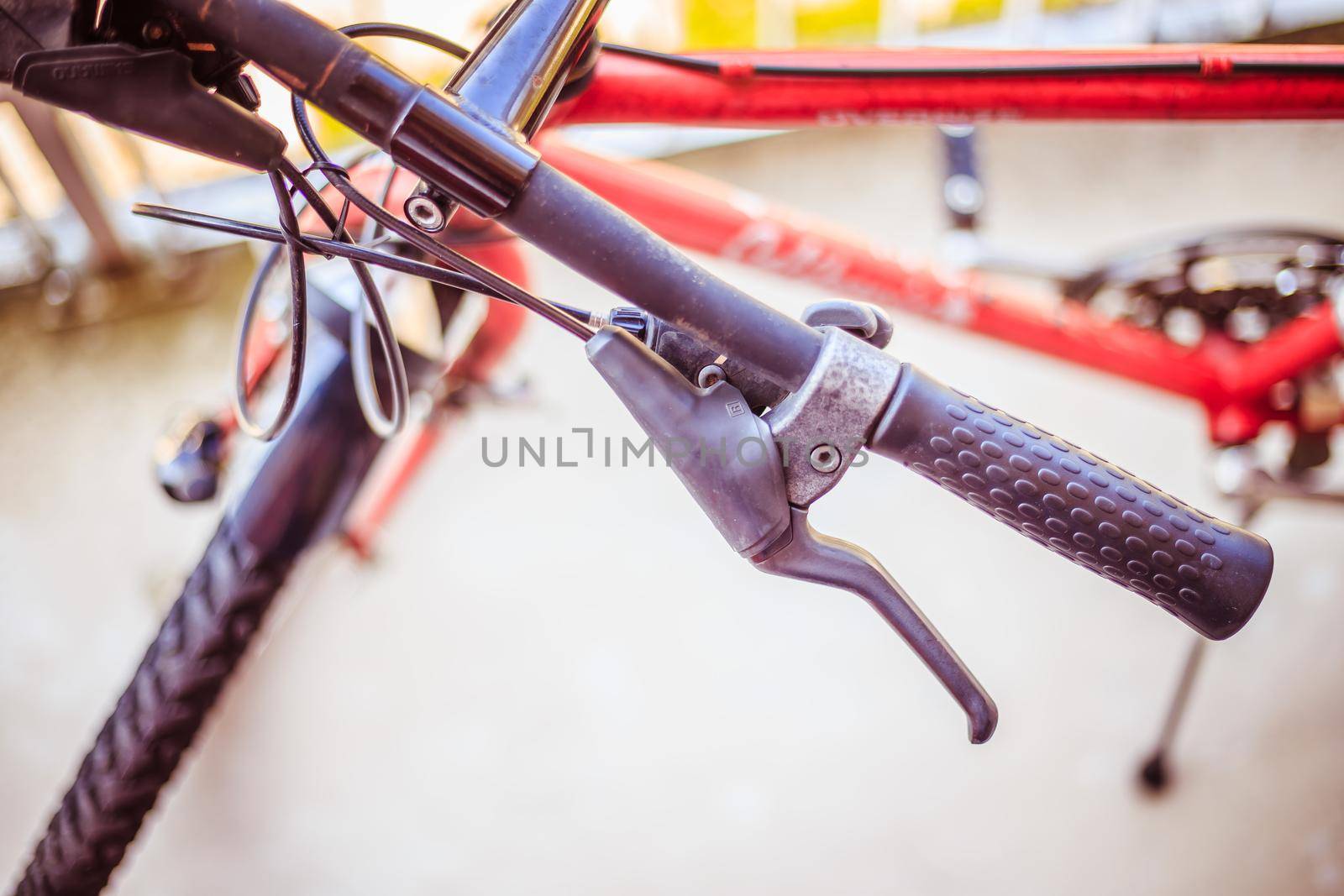 Closeup picture of a bicycle handlebar and breaks, bike repair, blurred background