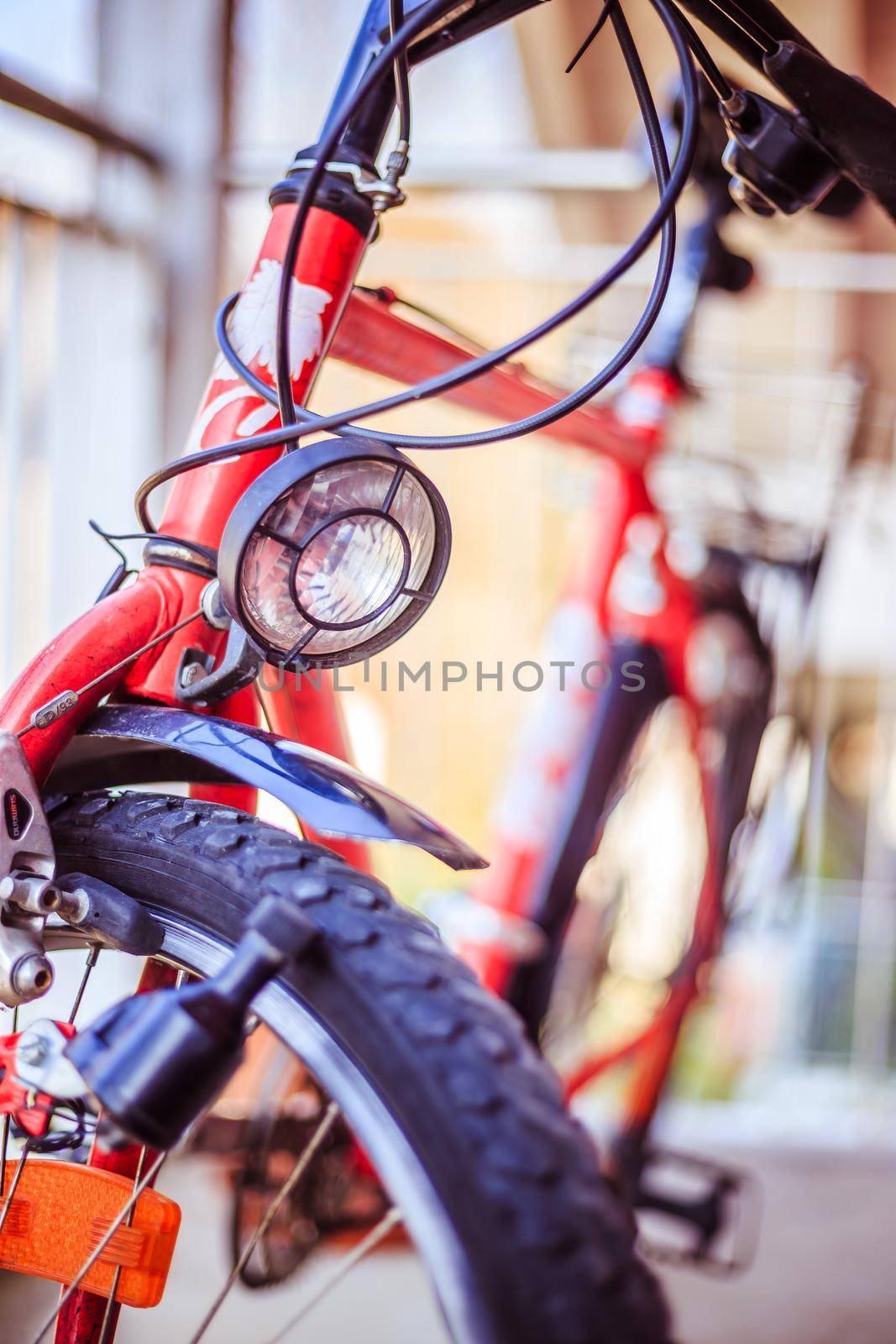 Bike in the city: Front picture of a city bike, blurred background by Daxenbichler