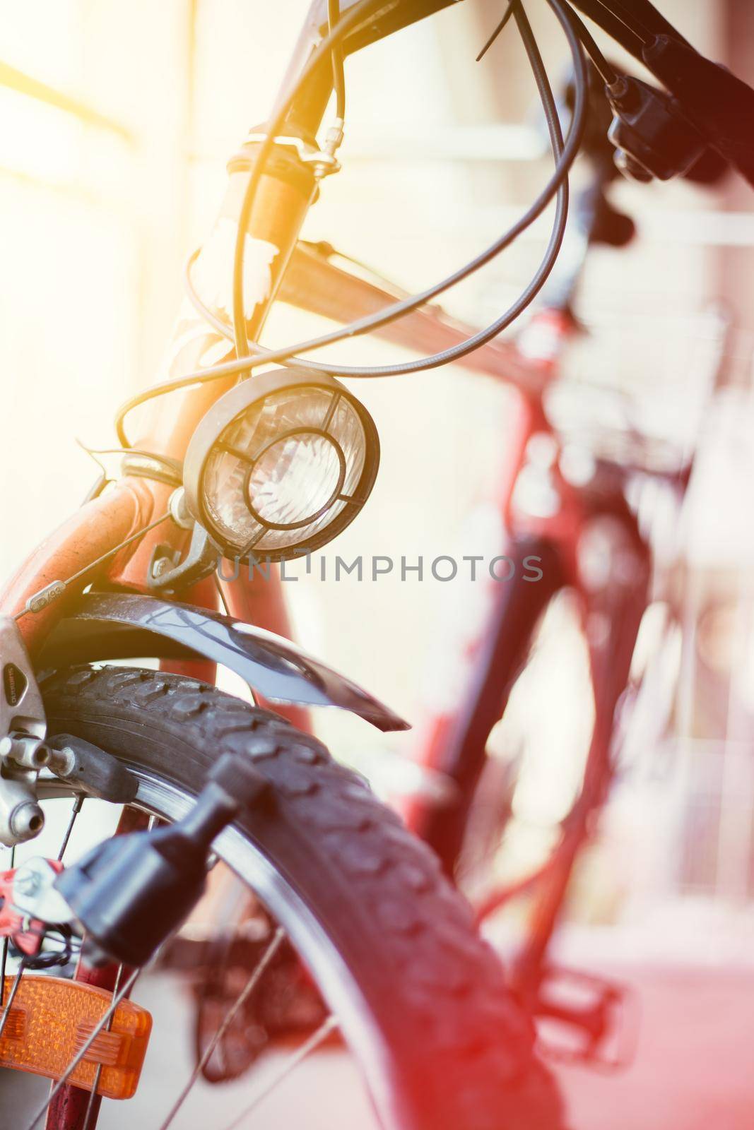 Bike in the city: Front picture of a city bike, blurred background by Daxenbichler