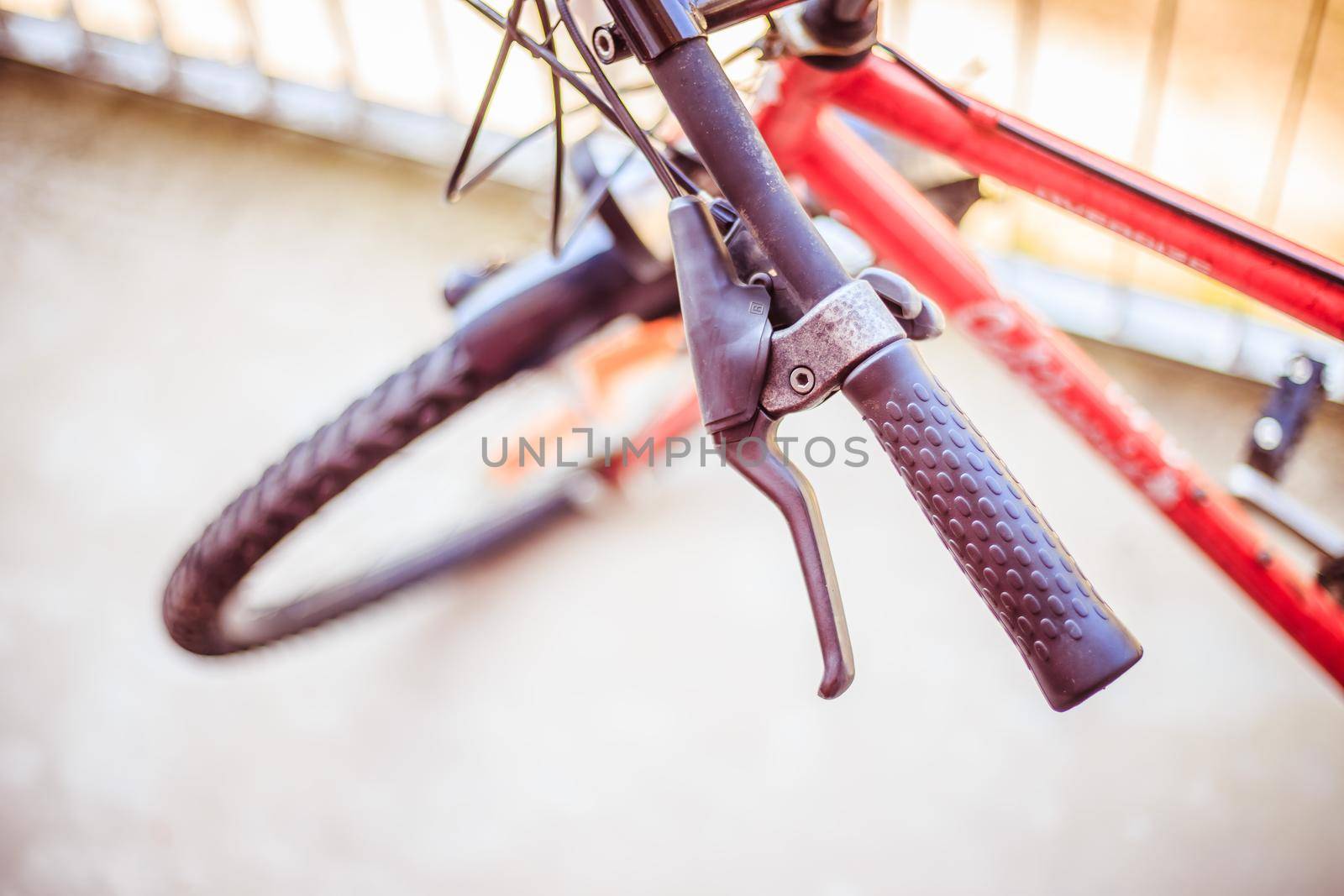 Closeup picture of a bicycle handlebar and breaks, bike repair, blurred background