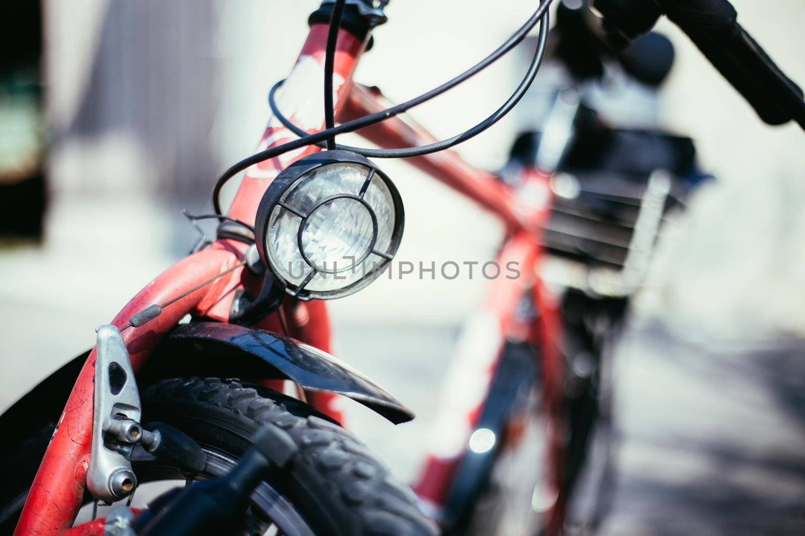 Bike in the city: Front picture of a city bike, blurred background by Daxenbichler