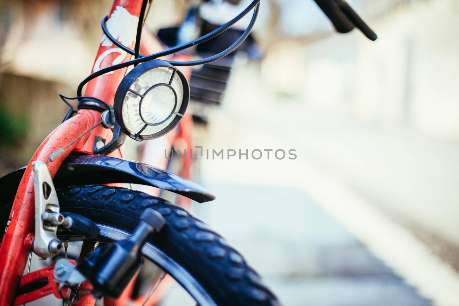 Bike in the city: Front picture of a city bike, blurred background by Daxenbichler