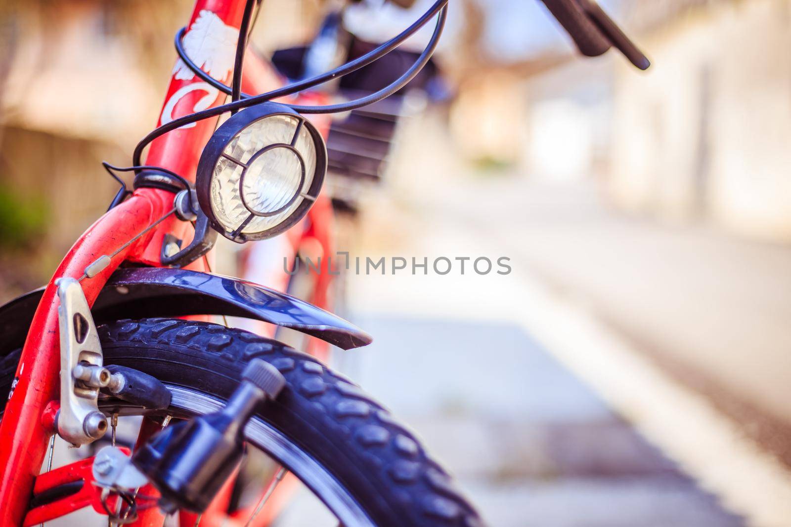 Bike in the city: Front picture of a city bike, blurred background by Daxenbichler