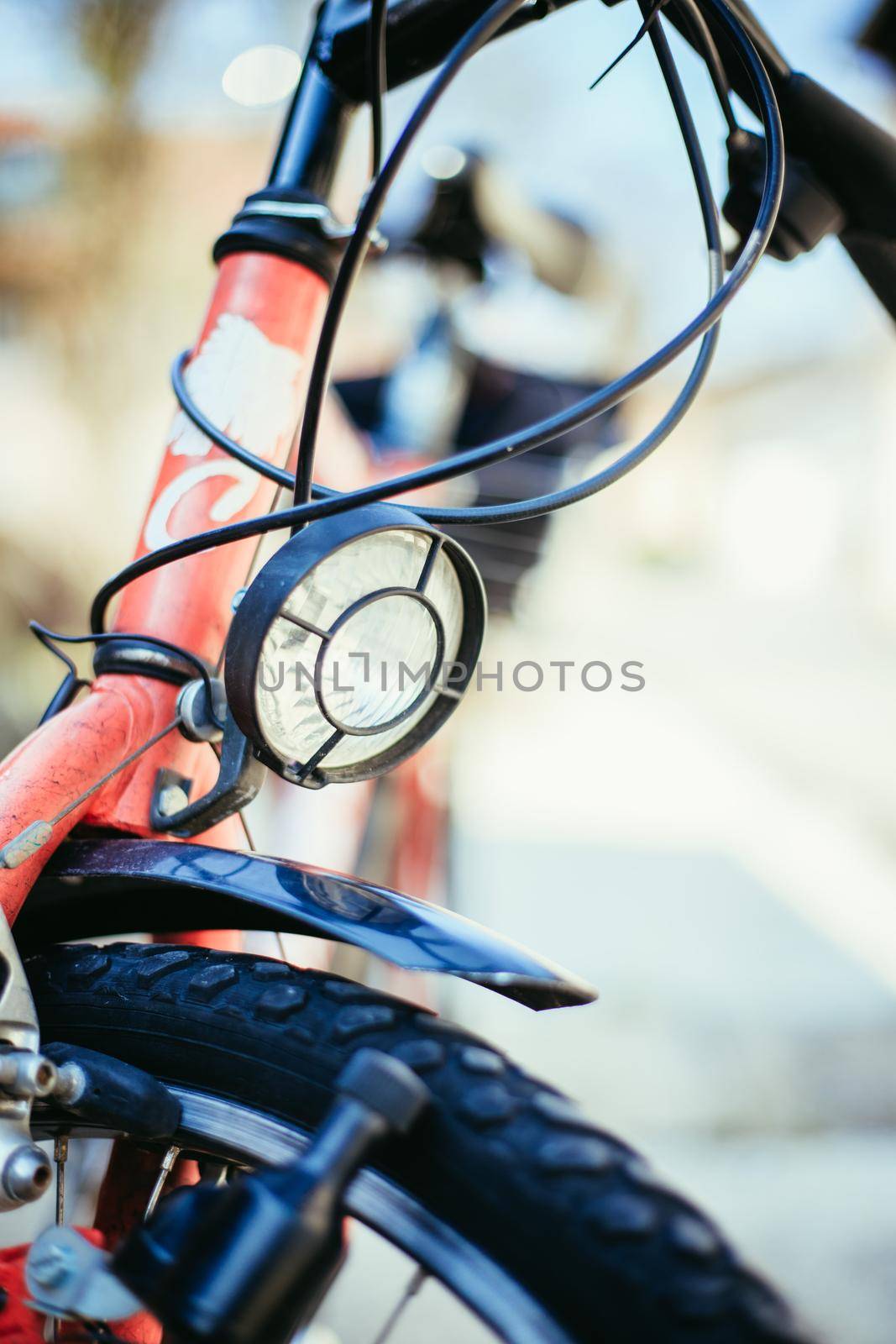 Bike in the city: Front picture of a city bike, blurred background by Daxenbichler