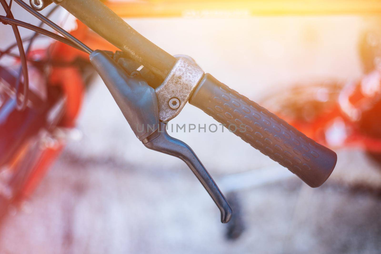 Closeup picture of a bicycle handlebar and breaks, bike repair, blurred background