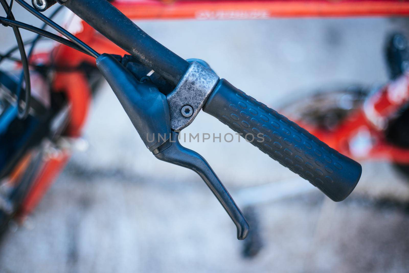 Closeup picture of a bicycle handlebar and breaks, bike repair, blurred background
