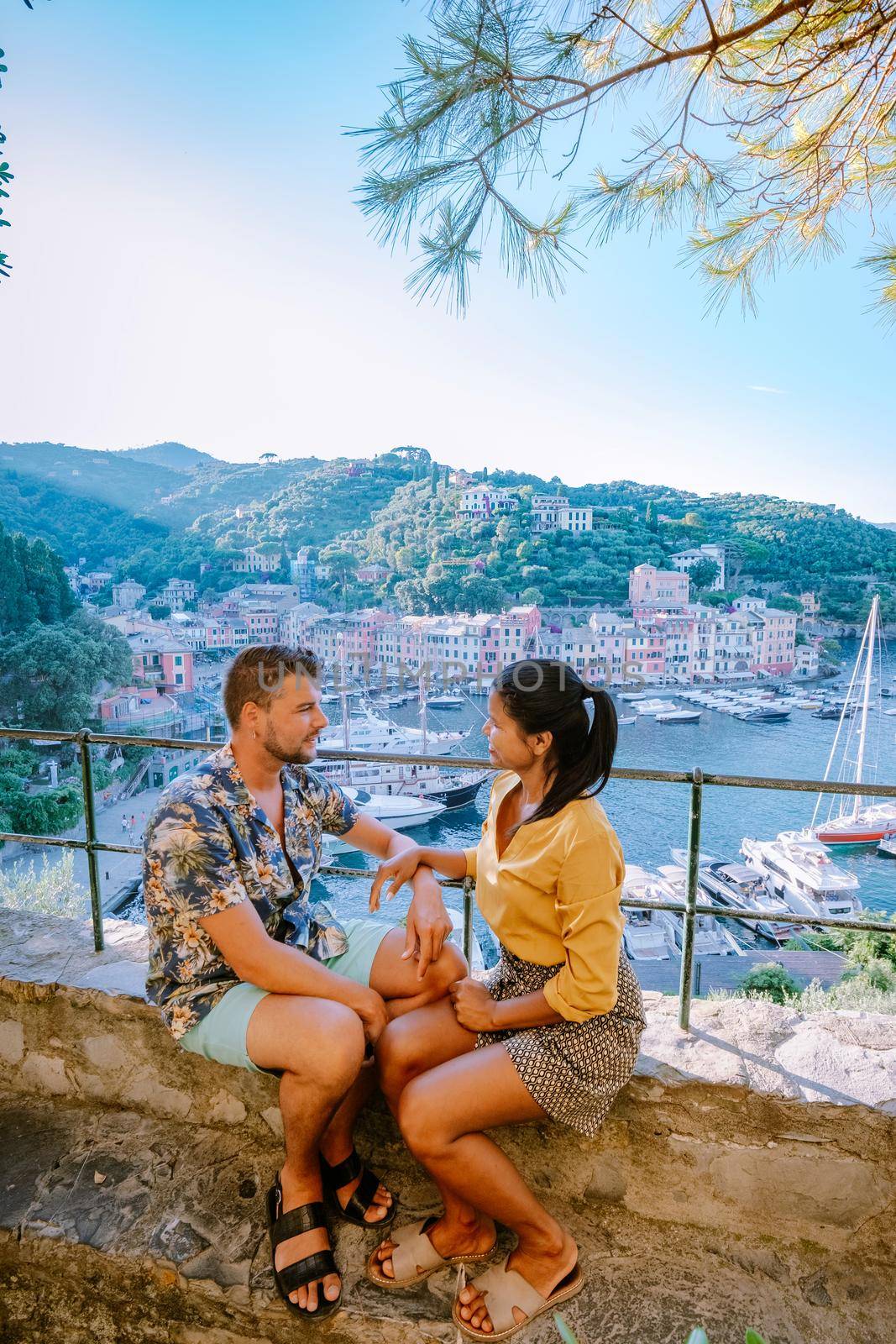 couple on vacation ligurian coast Italy, Portofino famous village bay, Italy colorful village Ligurian coast by fokkebok