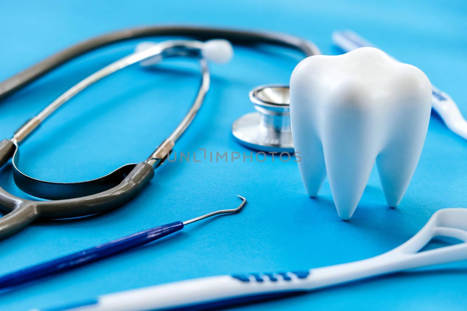 Dental model and dental equipment on blue background, concept image of dental background. dental hygiene background