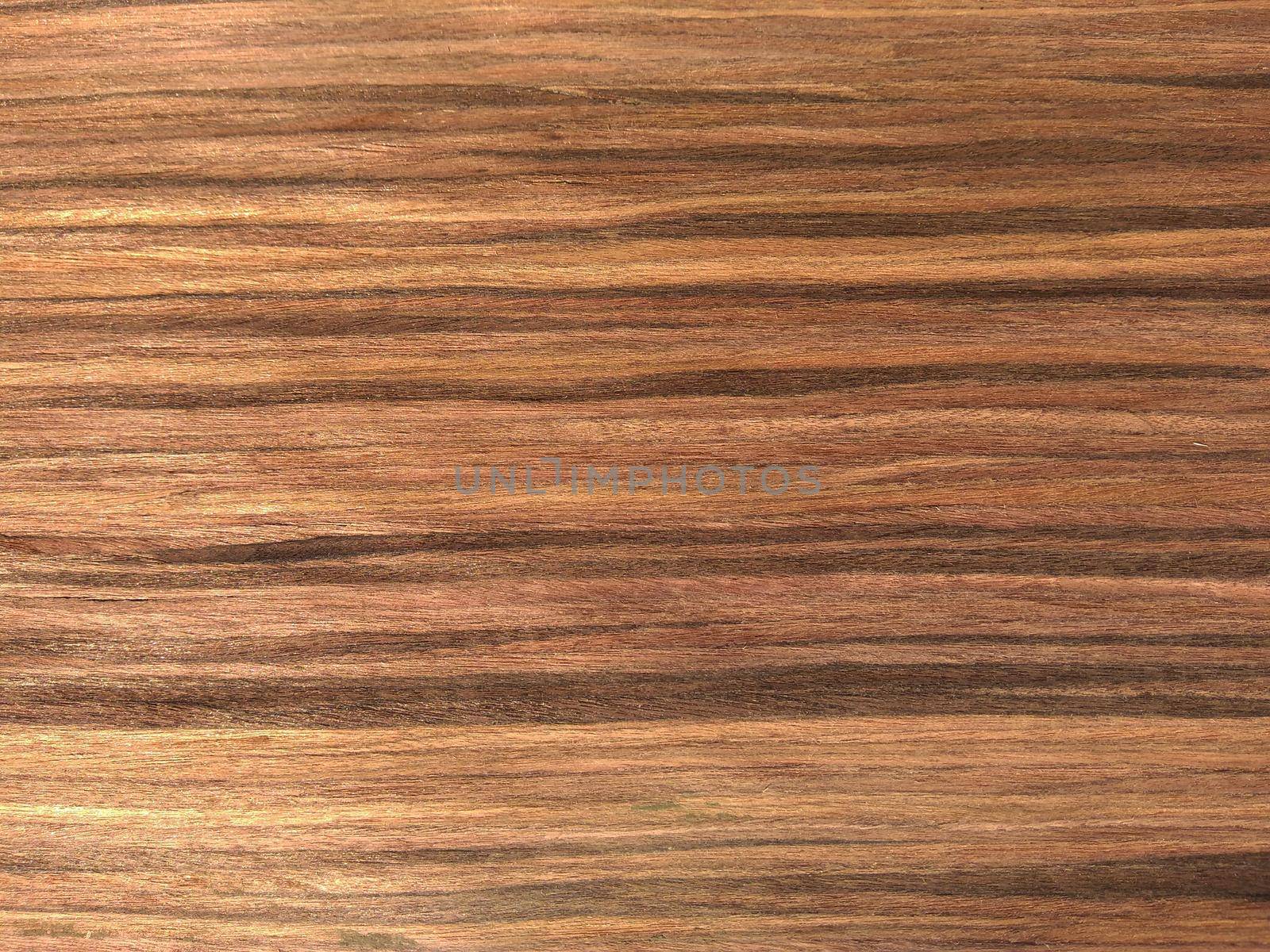 Natural earthen rose wood texture background. veneer surface for interior and exterior manufacturers use.