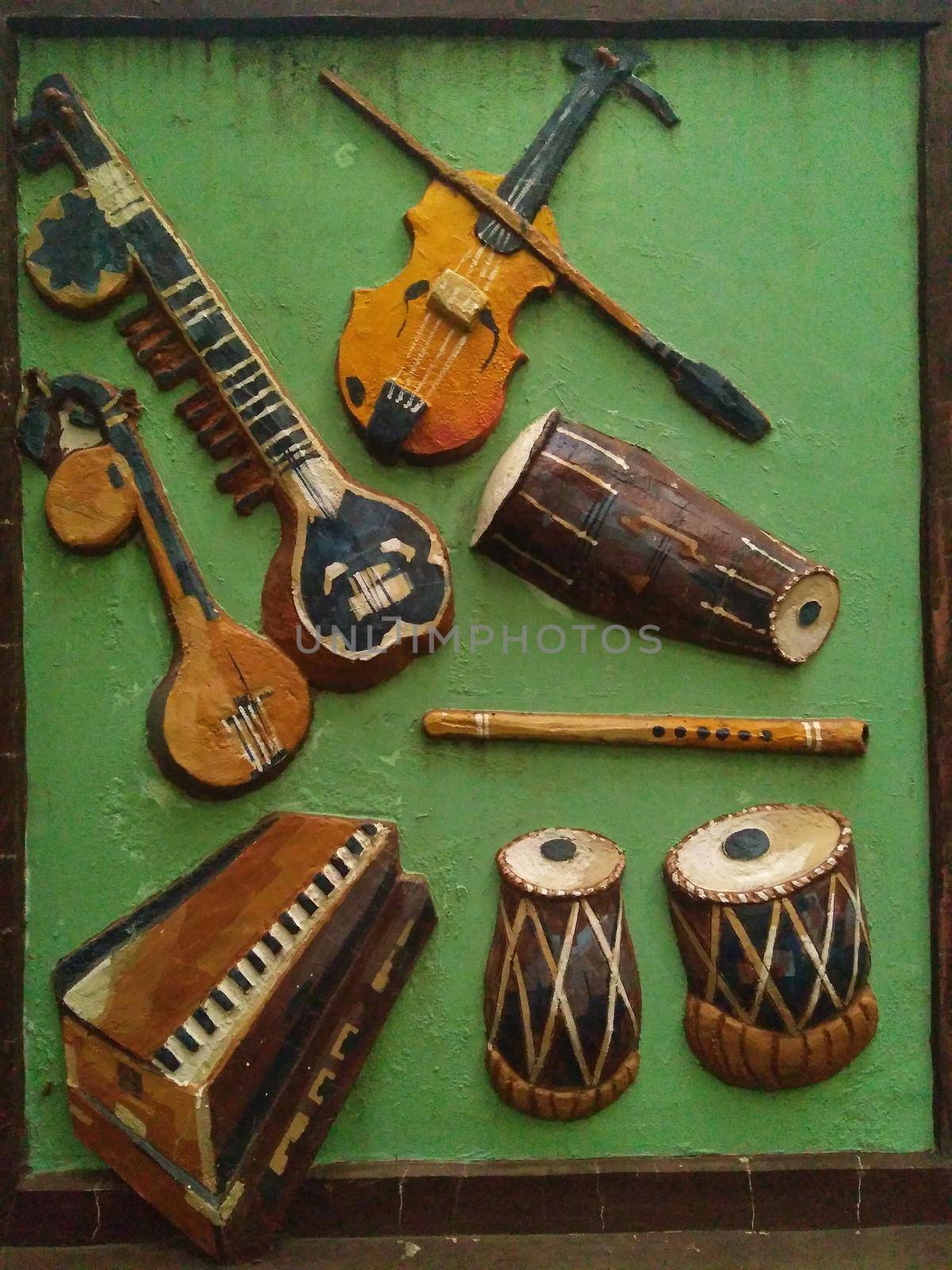 Indian traditional music instrument isolated on green background.