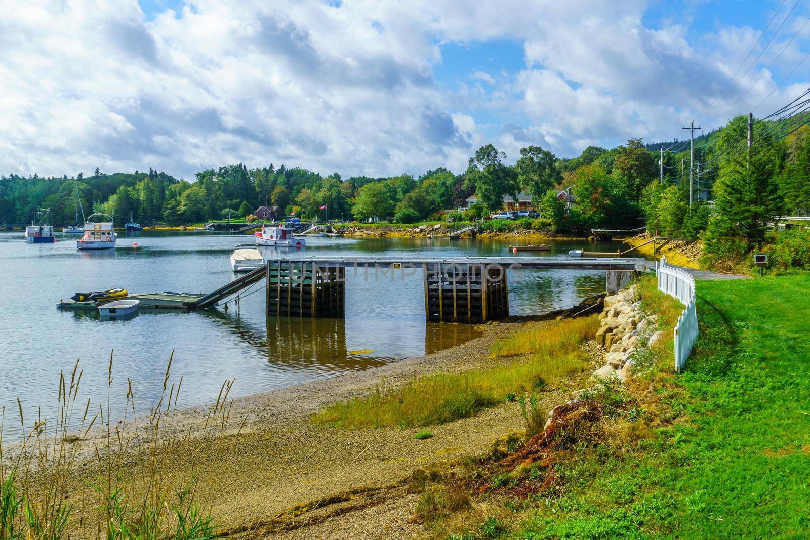 Views of the bay, boats and waterfront buildings in Head of Saints, Nova Scotia, Canada