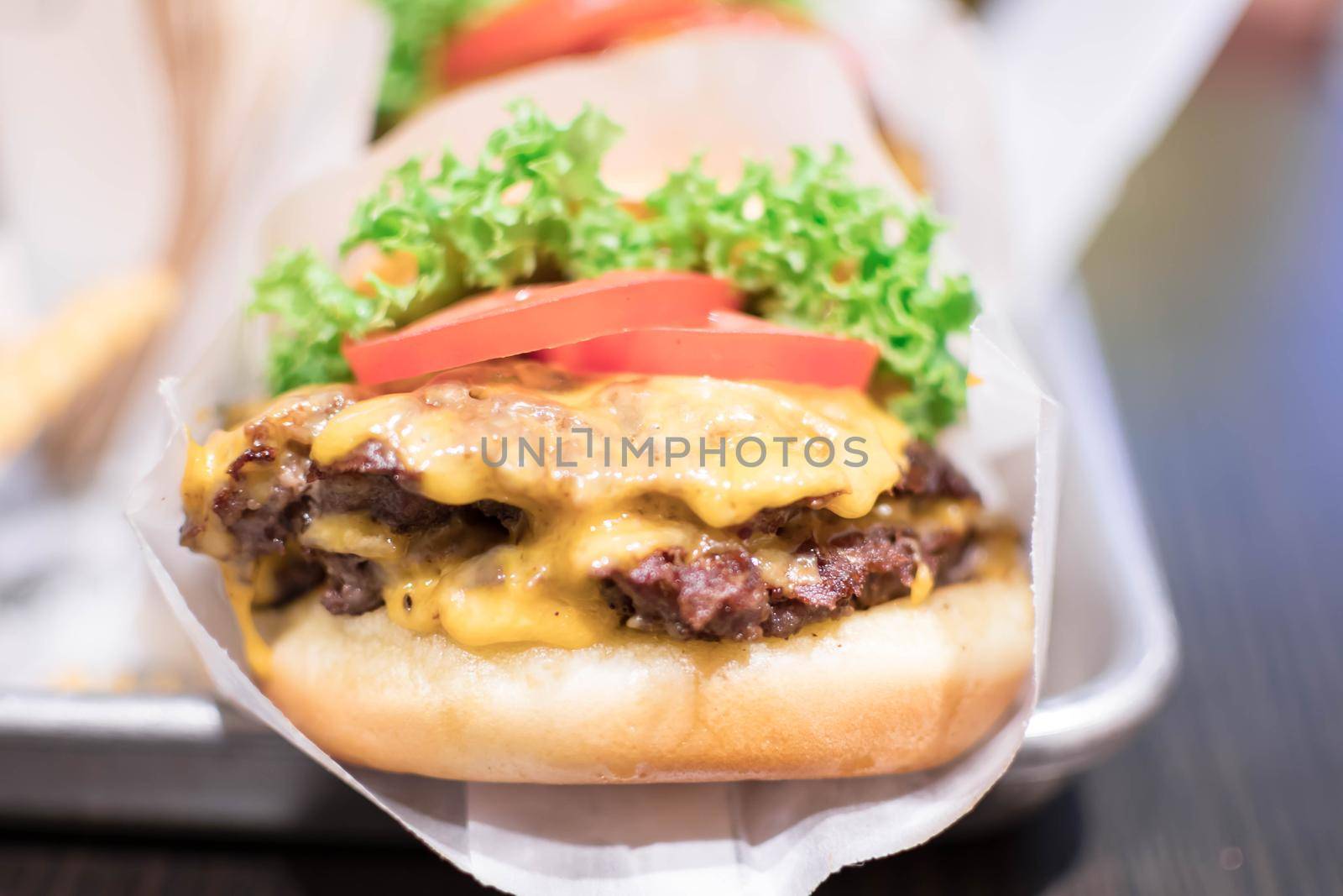 Shake shack burger yummy beef burger with melting cheese and vegetables.