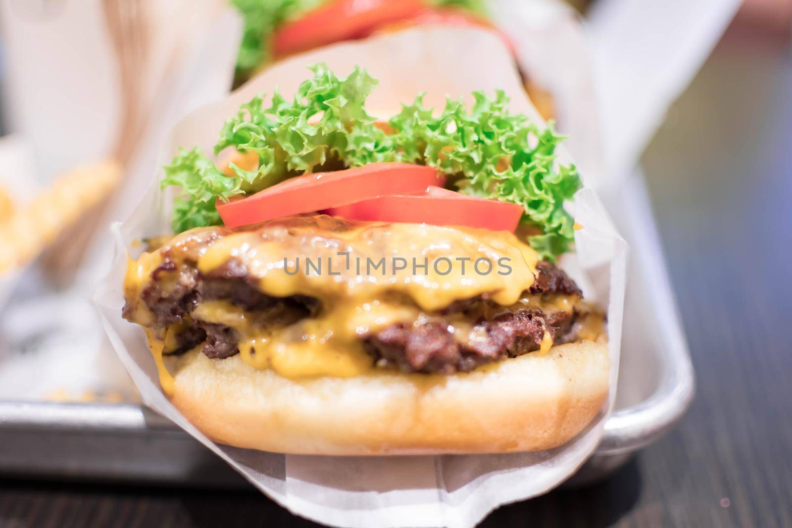 Shake shack burger yummy beef burger with melting cheese and vegetables.