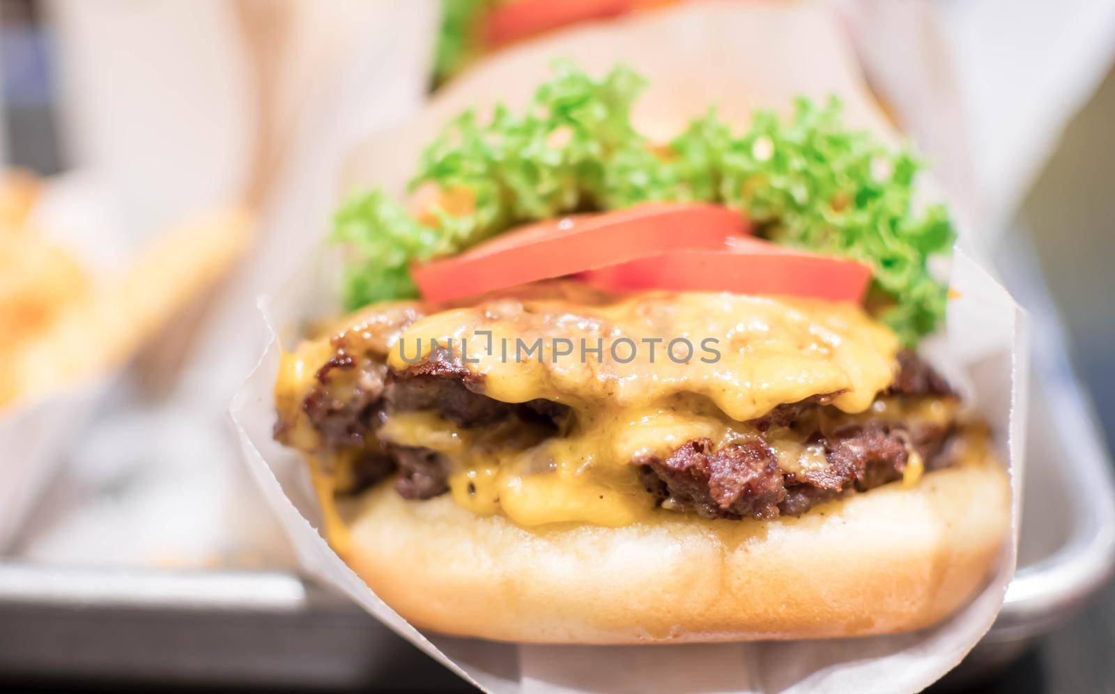 Shake shack burger yummy beef burger with melting cheese and vegetables.