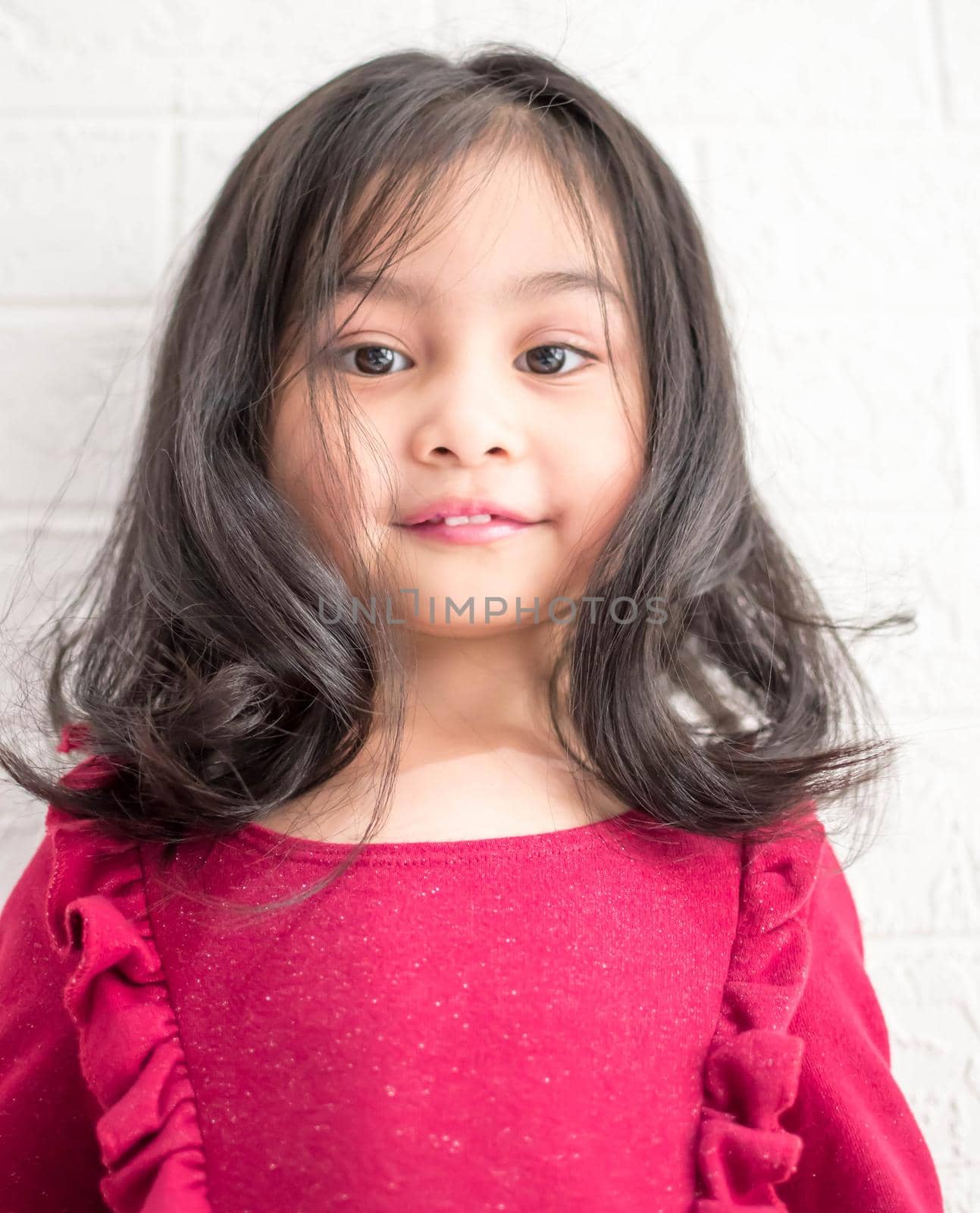 Fashion model and beauty look. Stylish girl with pretty face on grey background. Hairdresser, skincare, casual style. Beauty and kid fashion with healthy hair. Little girl with long hair. by billroque