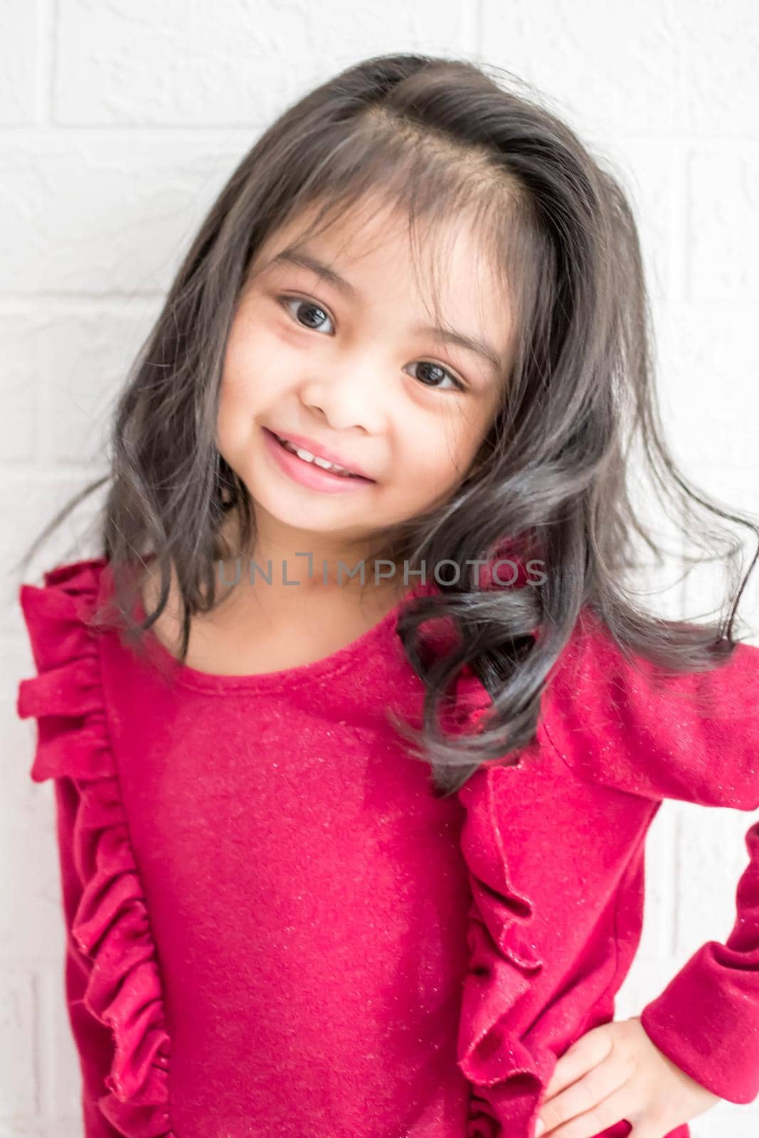 Fashion model and beauty look. Stylish girl with pretty face on grey background. Hairdresser, skincare, casual style. Beauty and kid fashion with healthy hair. Little girl with long hair. by billroque