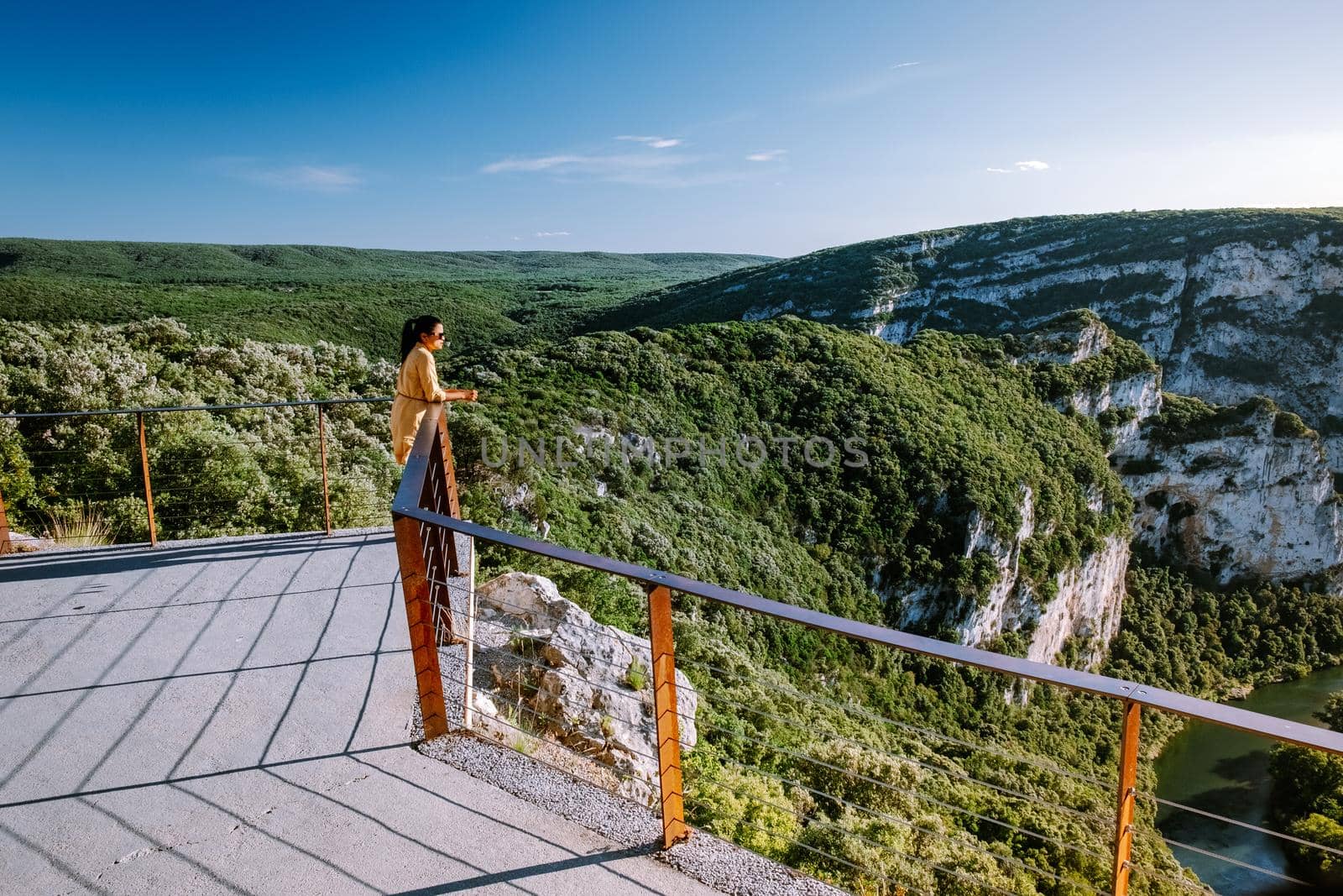 woman on vacation in the Ardeche France Pont d Arc, Ardeche France,view of Narural arch in Vallon Pont D'arc in Ardeche canyon in France by fokkebok