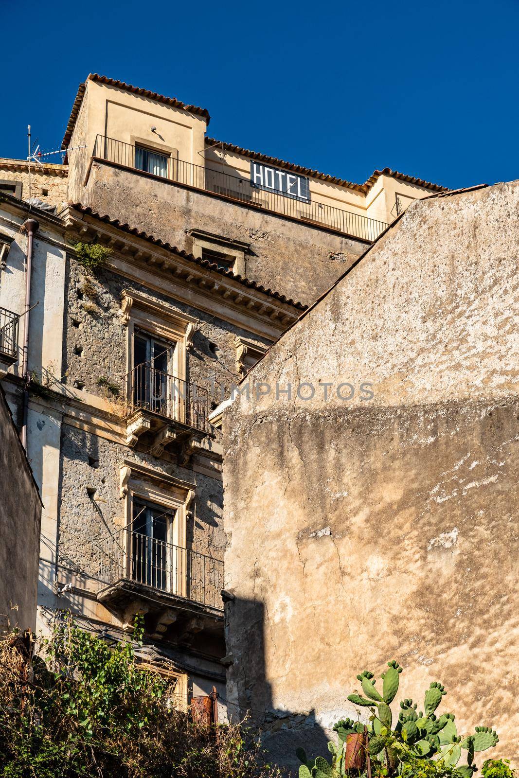 Old abandoned houses in a typical staircase road, Castiglione di Sicilia, Italy