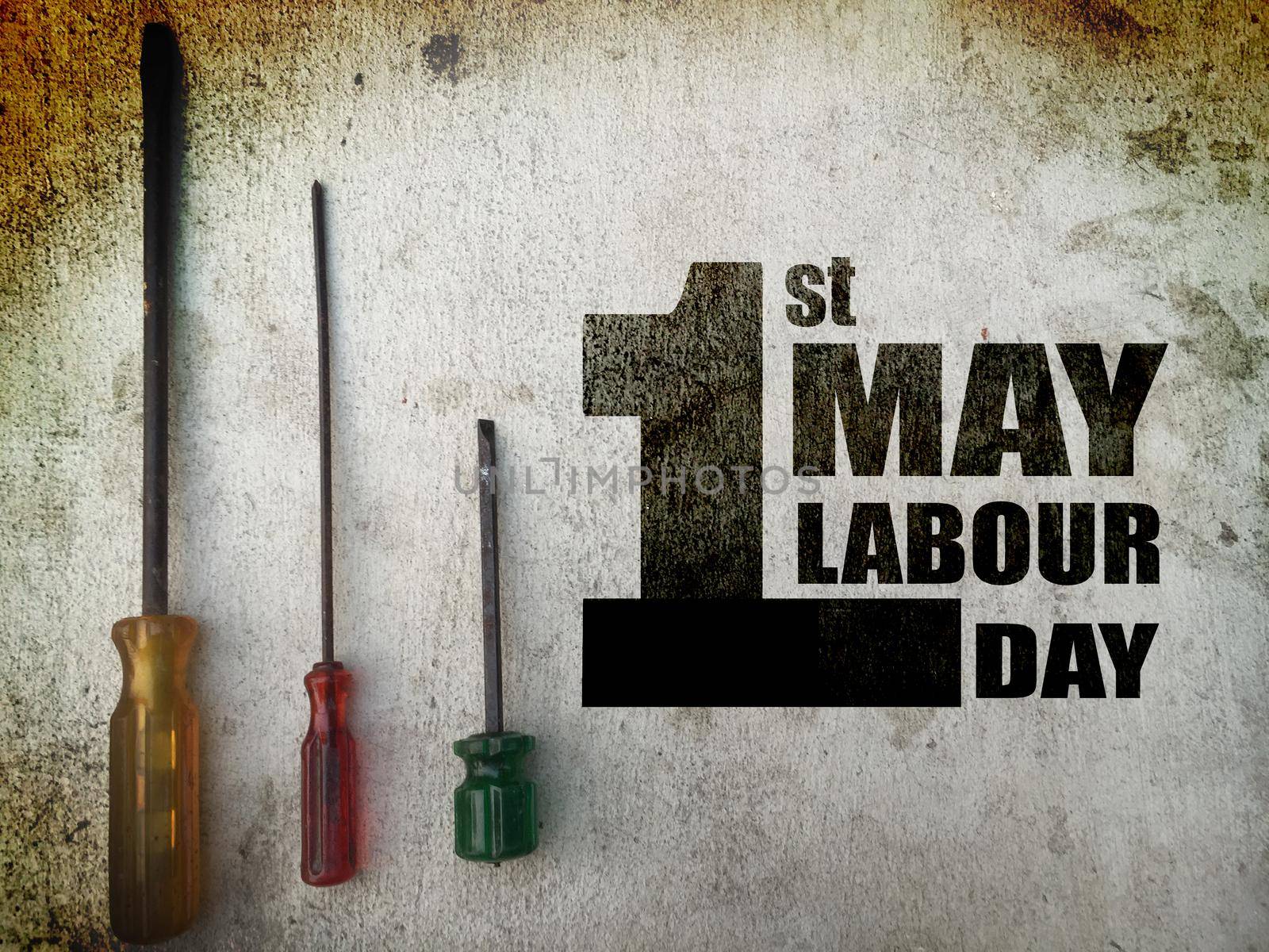 1st MAY Labour Day word on screwdrivers background grunge tone