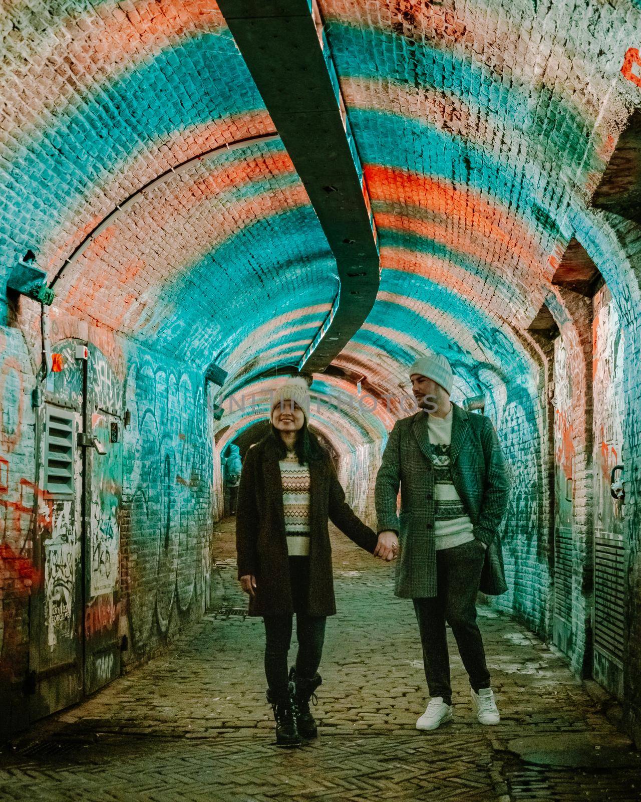  Utrecht Netherlands January 2021, colorful green, blue, pink illuminated Ganzemarkt tunnel in the center of Utrecht, The Netherlands