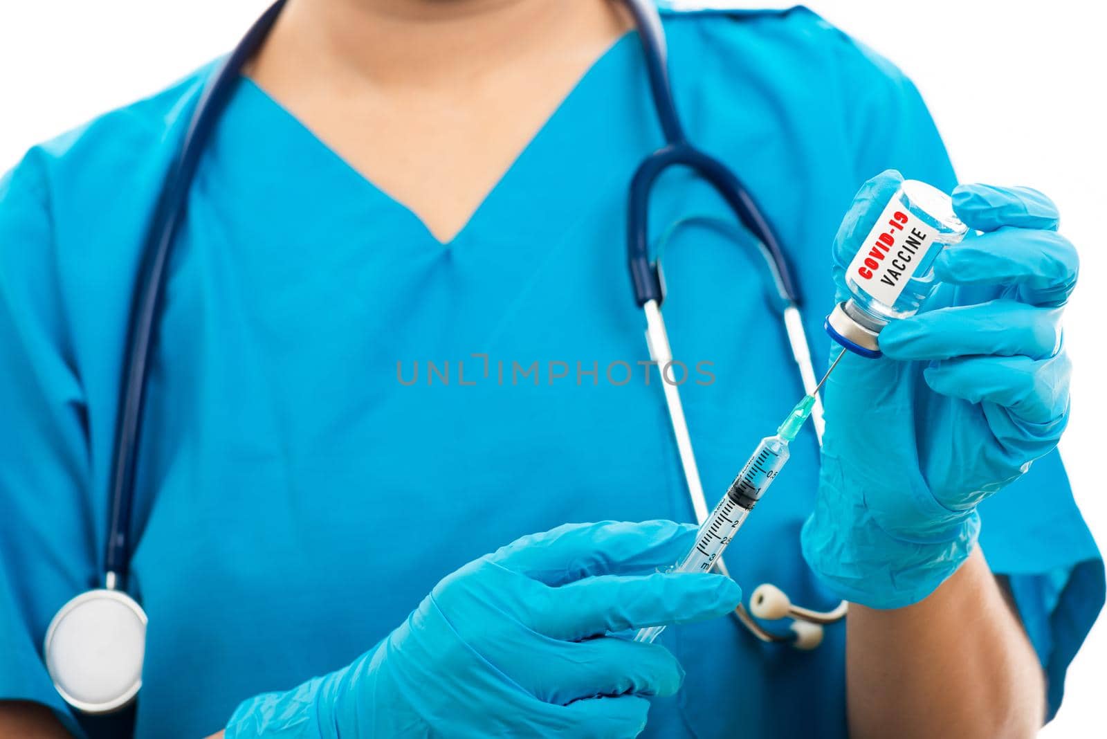 Female nurse with stethoscope puts on rubber gloves and wear medical face mask, woman doctor in blue uniform holding syringe 
 and COVID-19 vaccine, isolated white background, medical health concept