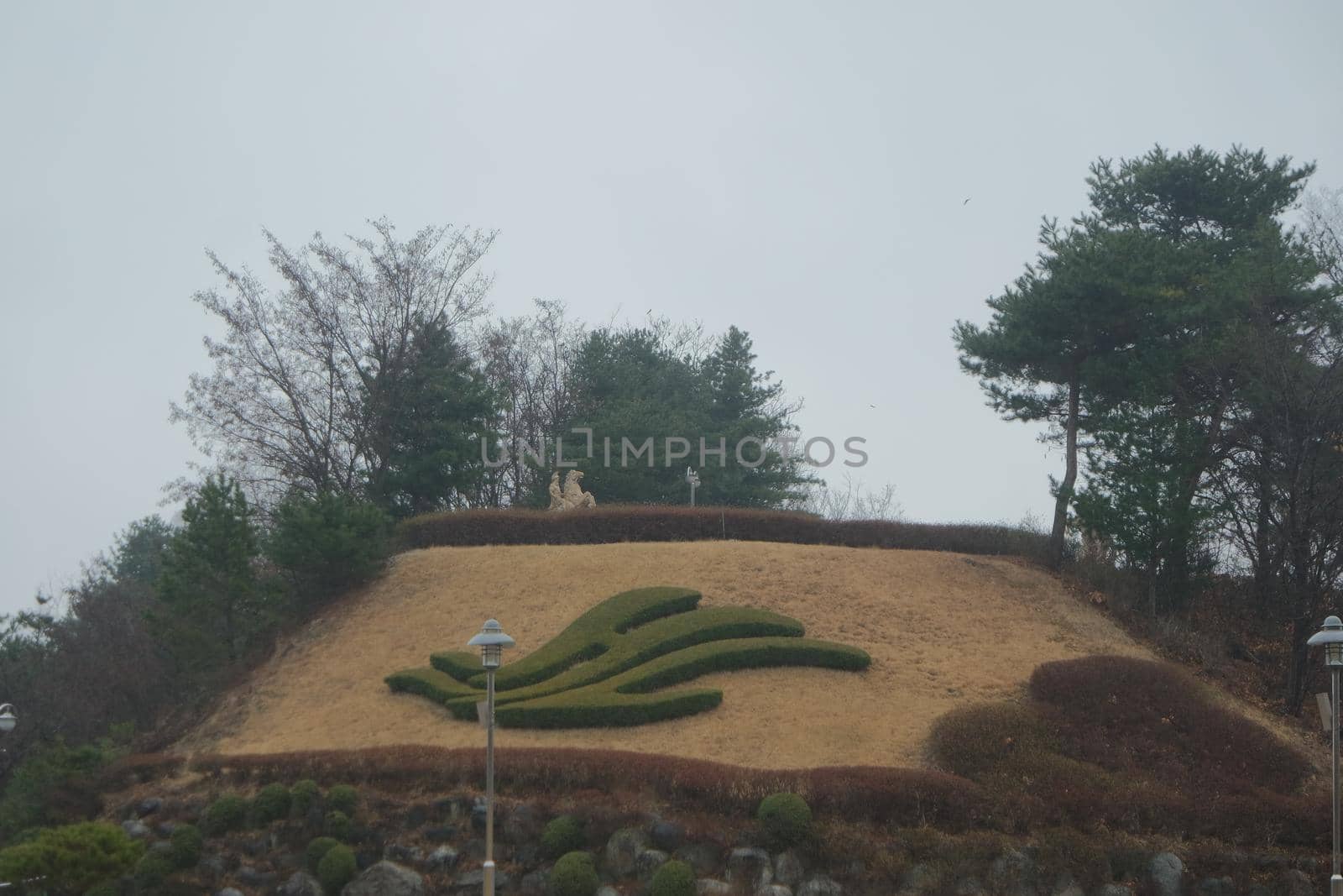 A beautiful grass cutting shape on a small mountain by Photochowk