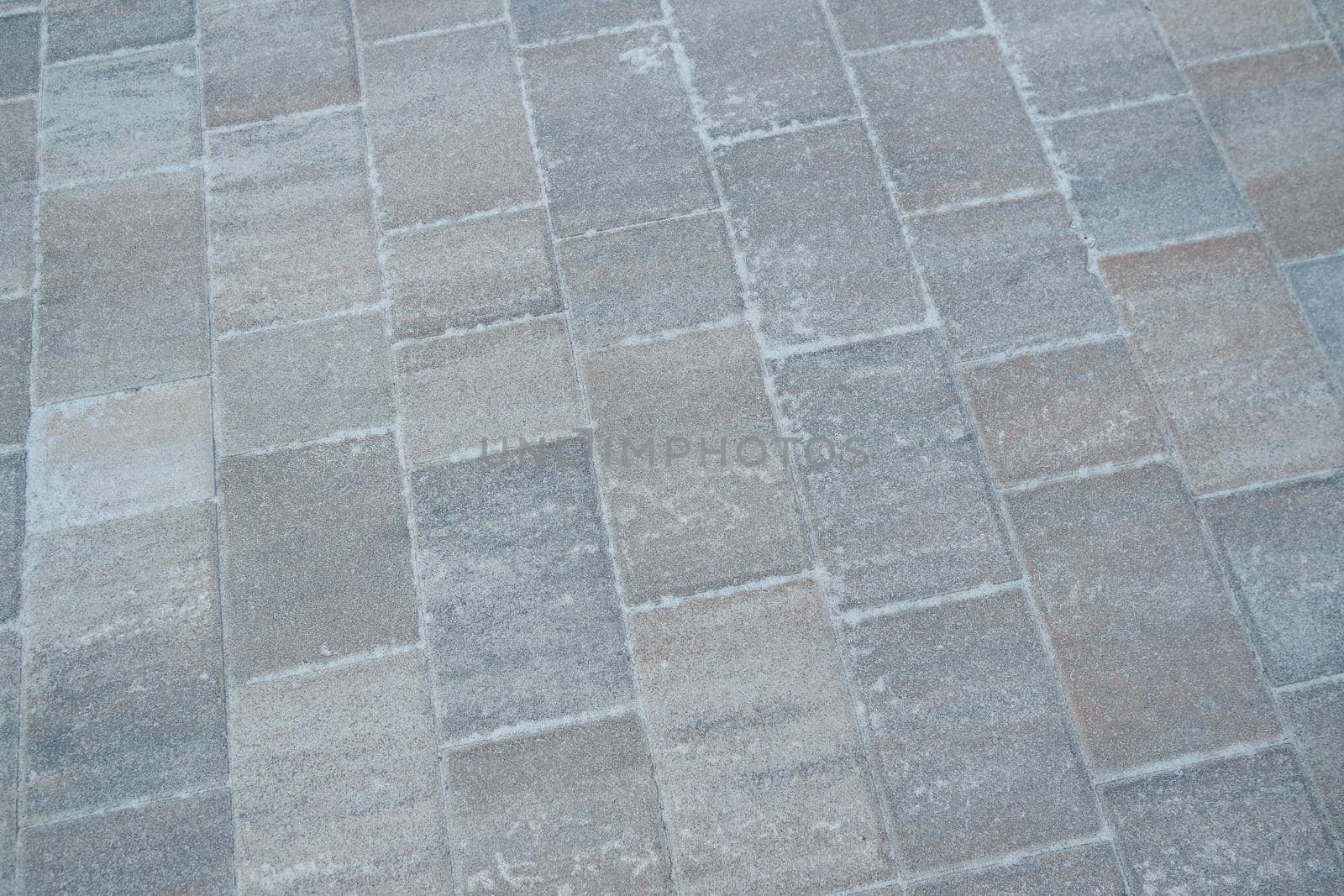 Closeup texture of brick floor. A background of a weathered old exterior brick floor with copy space for text