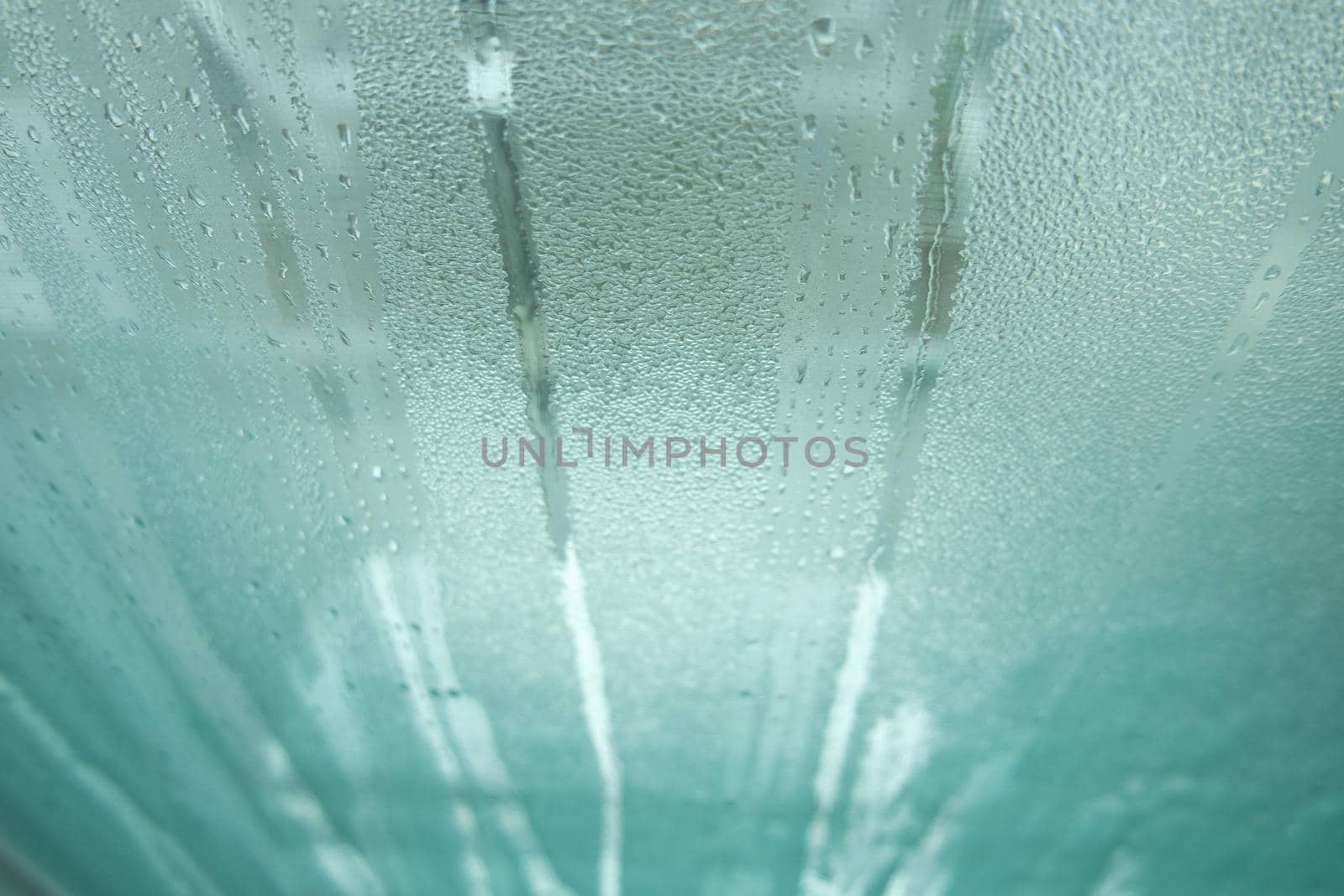 Bright grey color glassy texture, with water drops on it. Water drop glassy background