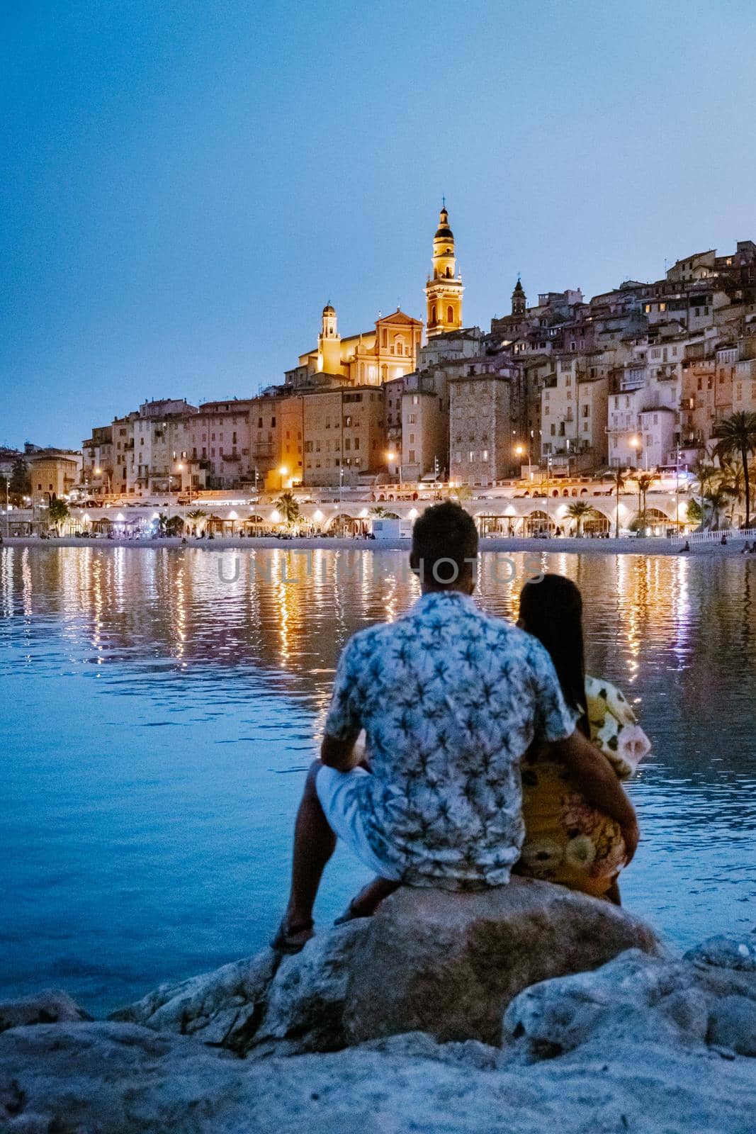 Menton France,couple men and woman on vacation at the Cote d Azur France, View on old part of Menton, Provence-Alpes-Cote d'Azur, France by fokkebok