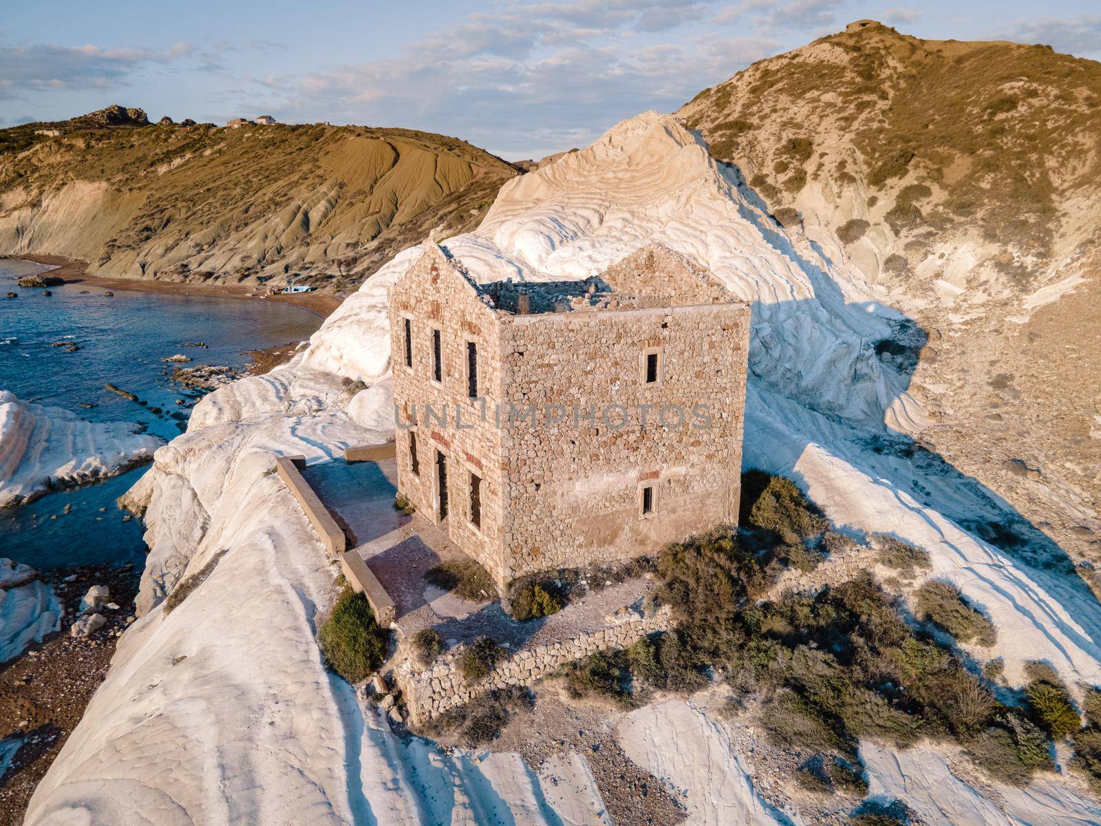 Punta Bianca, Agrigento in Sicily Italy White beach with old ruins of abandoned stone house on white cliffs by fokkebok