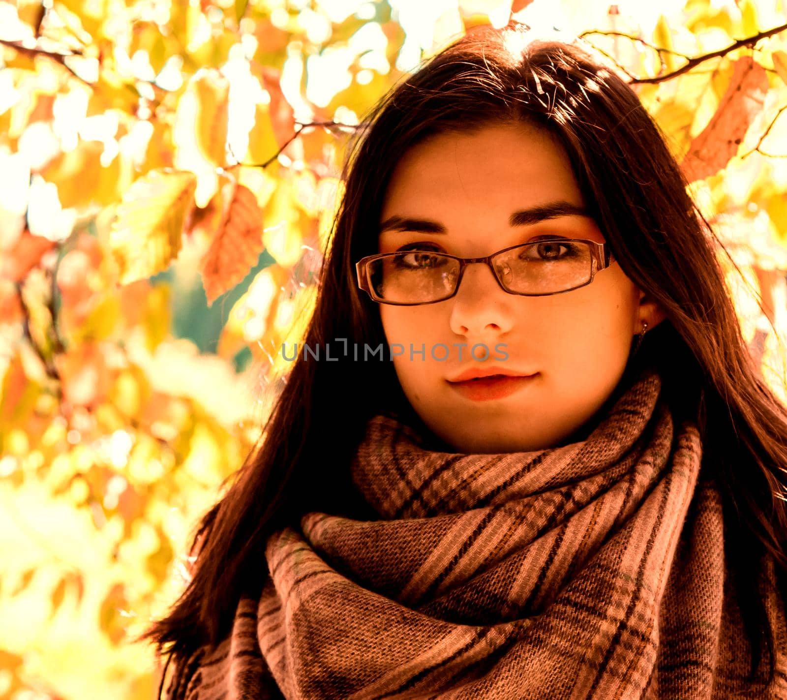 portrait of a young beautiful girl outdoor in city park by raddnatt