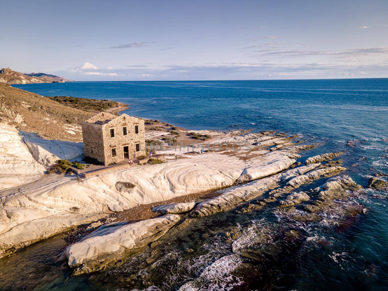 Punta Bianca, Agrigento in Sicily Italy White beach with old ruins of abandoned stone house on white cliffs by fokkebok