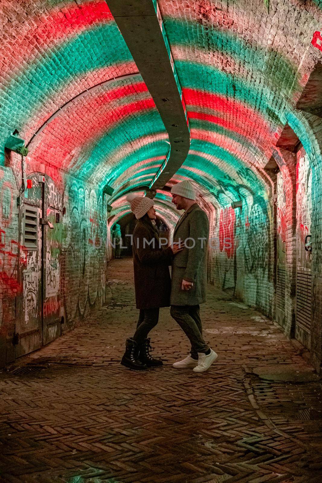  Utrecht Netherlands January 2021, colorful green, blue, pink illuminated Ganzemarkt tunnel in the center of Utrecht, The Netherlands