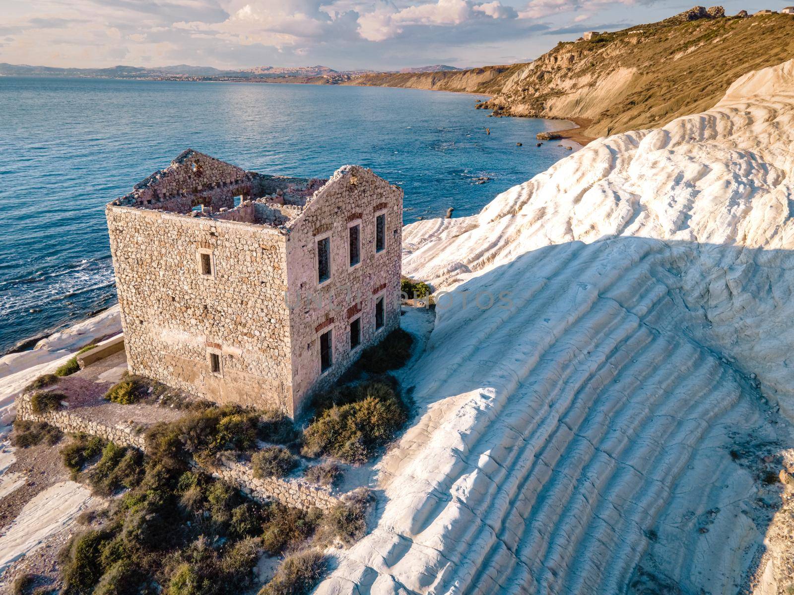 Punta Bianca, Agrigento in Sicily Italy White beach with old ruins of abandoned stone house on white cliffs by fokkebok