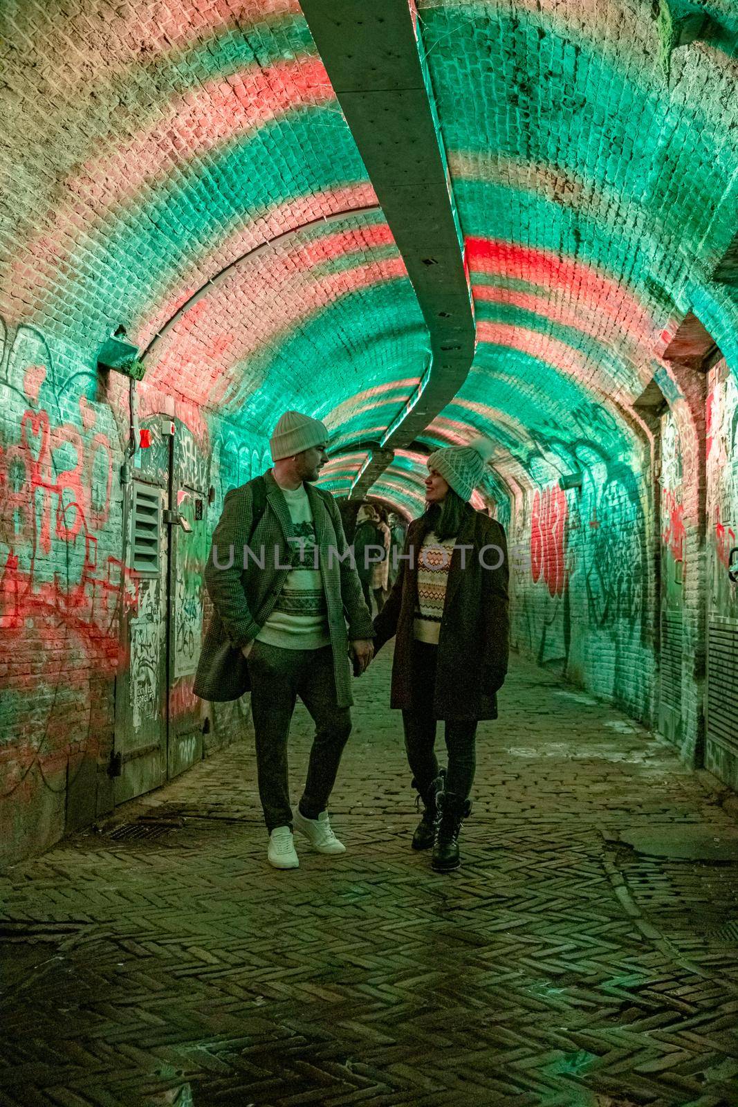  Utrecht Netherlands January 2021, colorful green, blue, pink illuminated Ganzemarkt tunnel in the center of Utrecht, The Netherlands