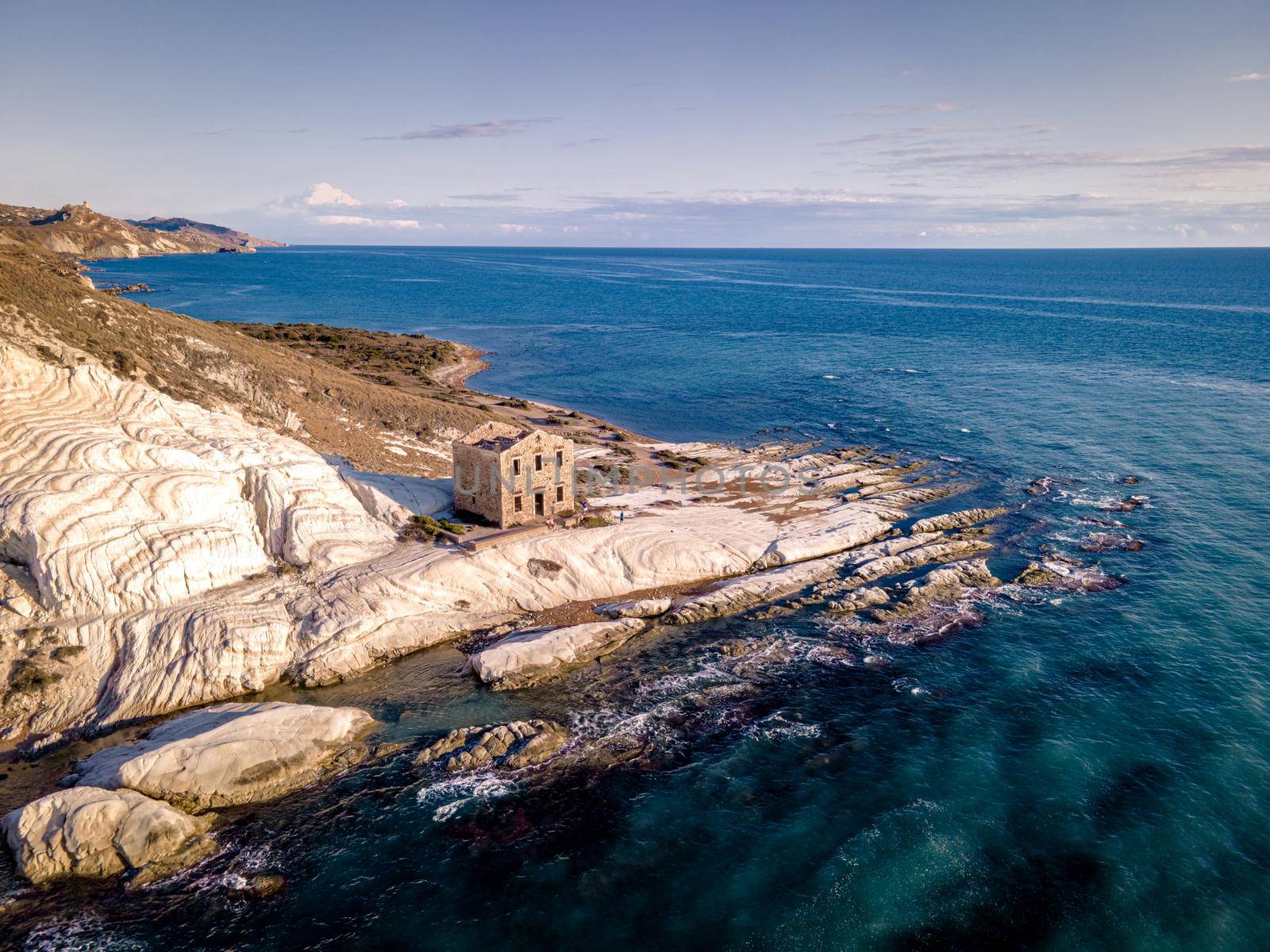 Punta Bianca, Agrigento in Sicily Italy White beach with old ruins of an abandoned stone house on white cliffs. Sicilia Italy, couple on vacation in Italy