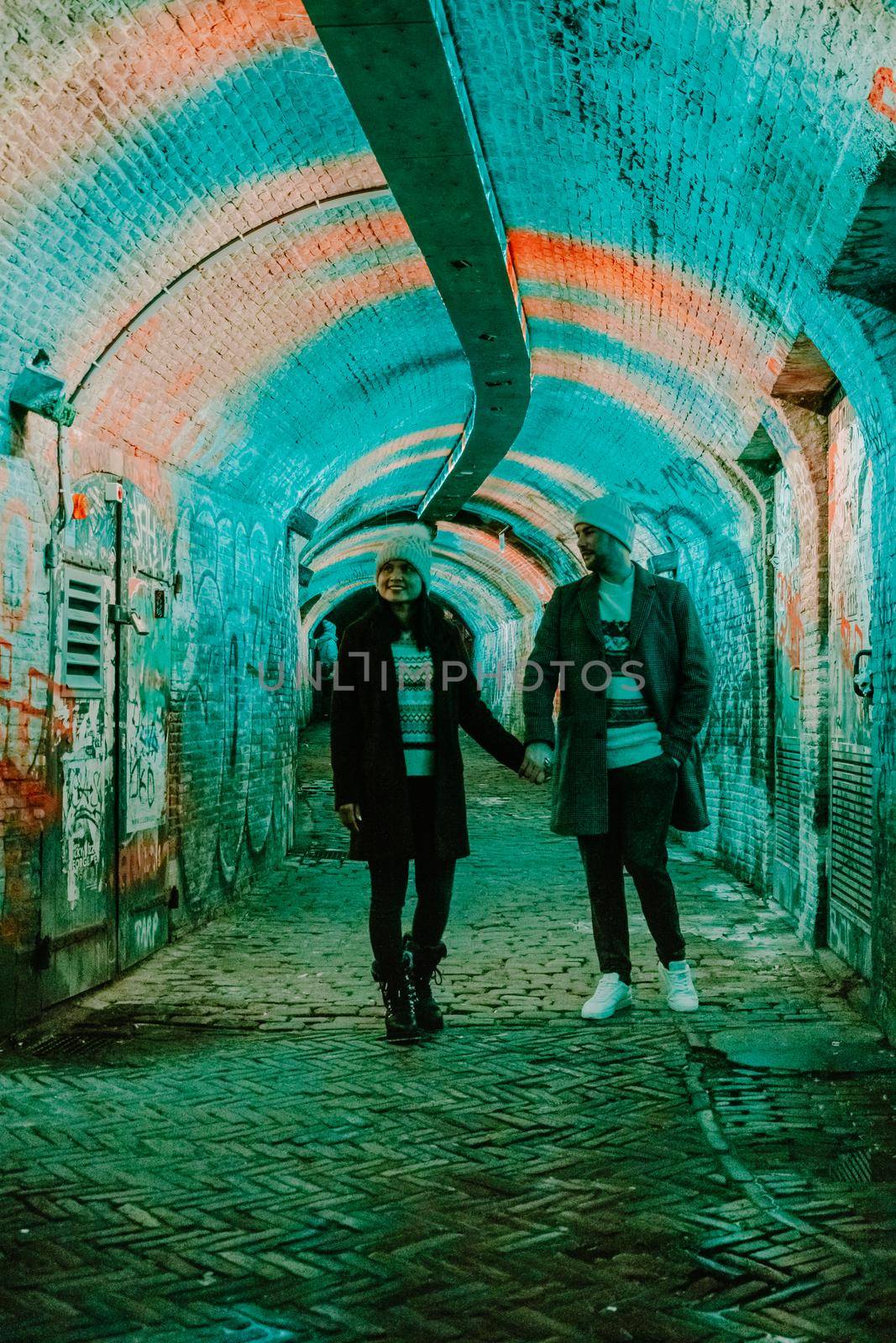  Utrecht Netherlands January 2021, colorful green, blue, pink illuminated Ganzemarkt tunnel in the center of Utrecht, The Netherlands