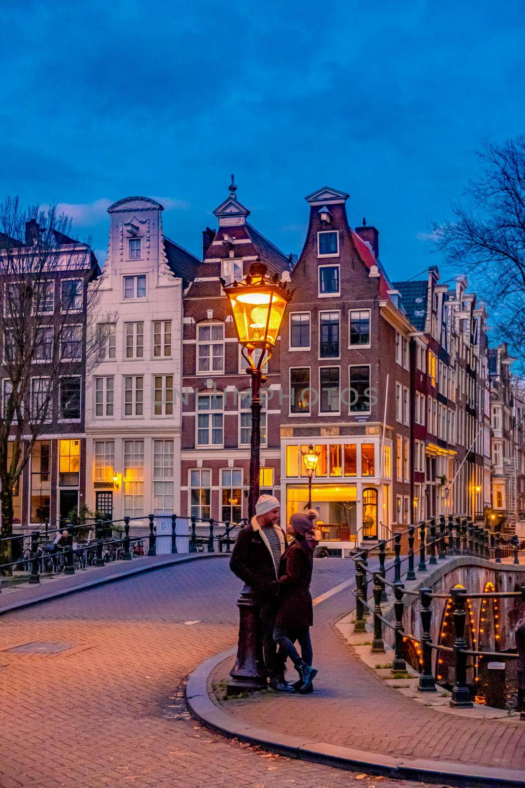 Amsterdam Netherlands during sunset, historical canals during sunset hours by fokkebok