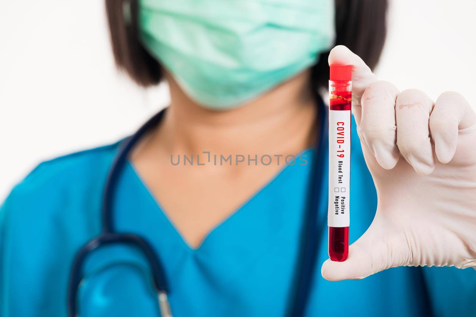 Nurse in blue uniform wear a mask holding test tube sample Coronavirus test blood in the laboratory for analyzing isolated on white background, medicine COVID-19 pandemic outbreak concept