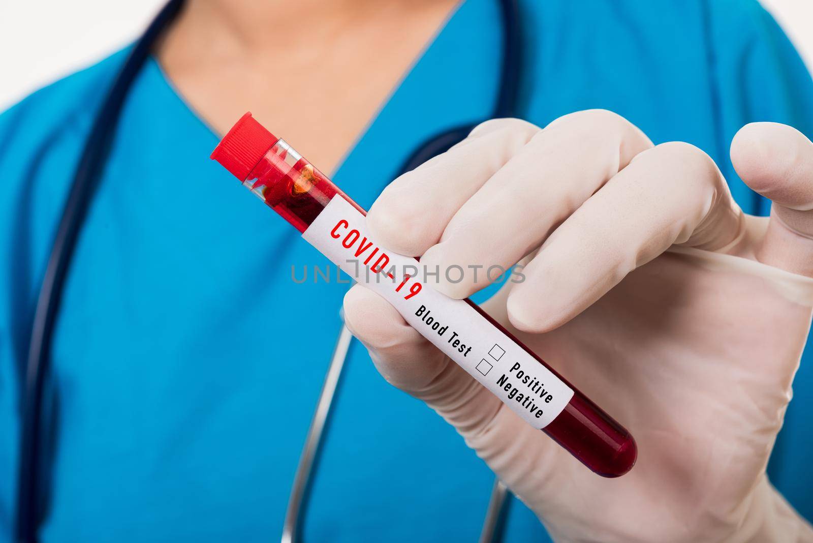 Nurse in blue uniform wear a mask holding test tube sample Coronavirus test blood in the laboratory for analyzing isolated on white background, medicine COVID-19 pandemic outbreak concept