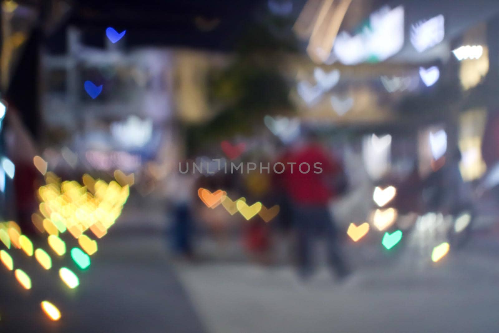 bokeh heart shape love valentine colorful night light on floor at shopping mall