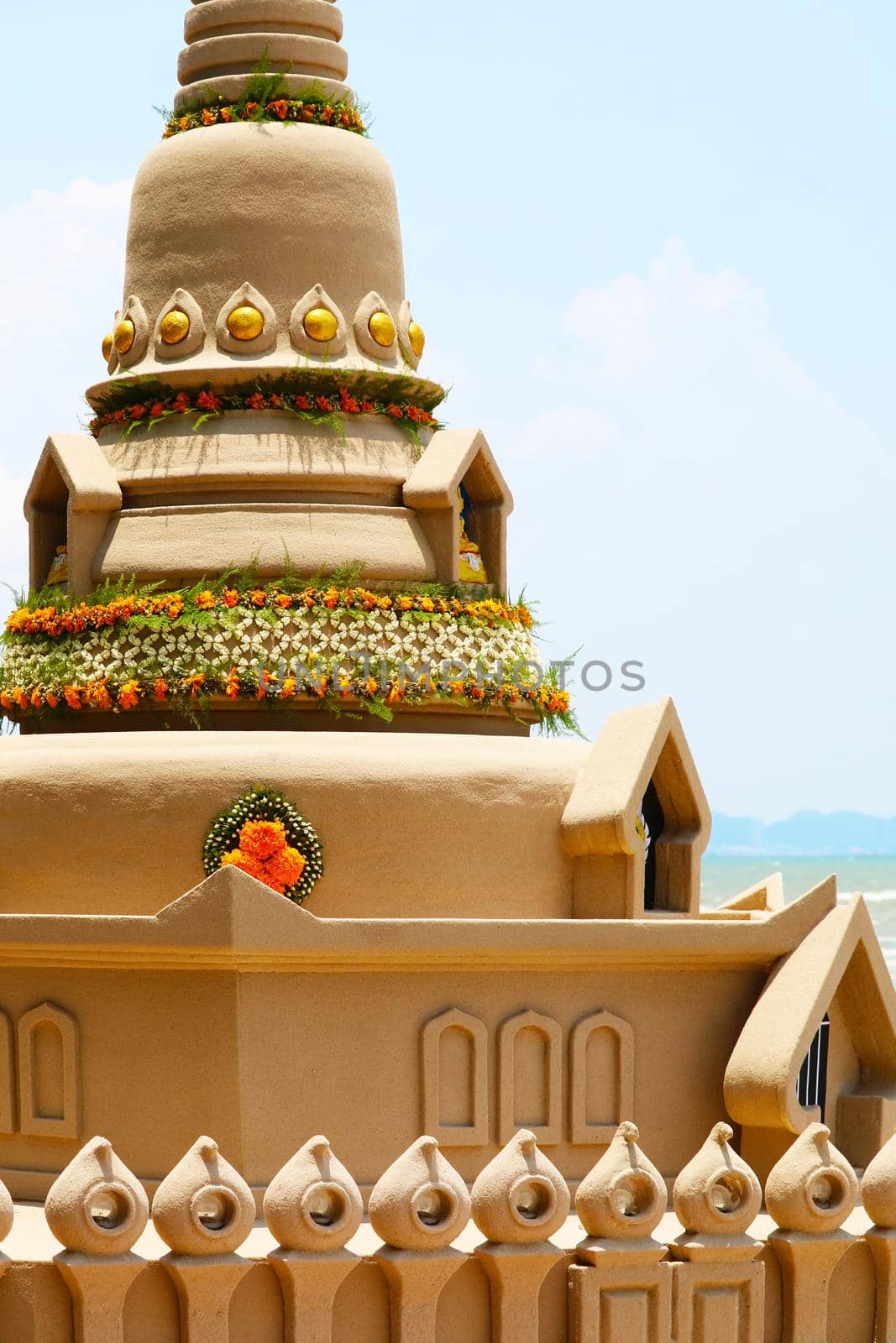detail of window sand pagoda in Songkran festival represents In order to take the sand scraps attached to the feet from the temple to return the temple in the shape of a sand pagoda