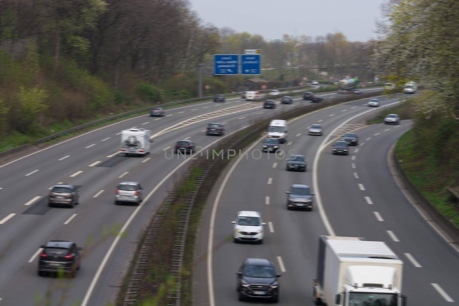 Cars on a german highway in after-work traffic. Shot with motion blur.