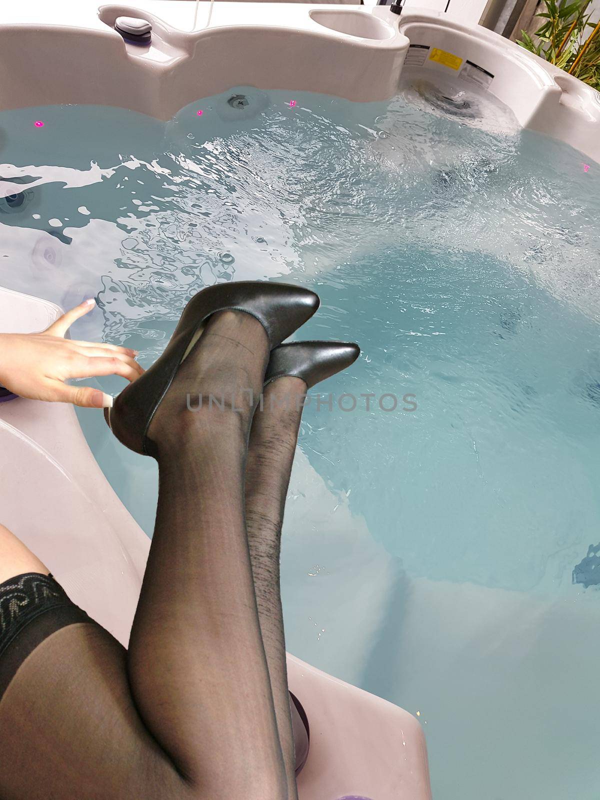 Woman legs in black nylon stockings at the hot tub    by JFsPic