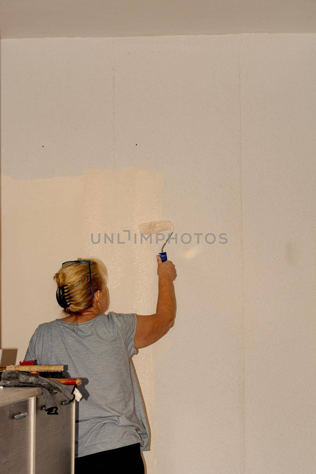 Senior woman at renovation            by JFsPic