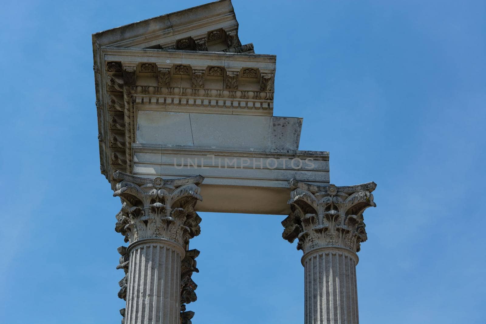 Greek columns of a temple in Greece, seen from below. Architecture, history, travel, landscapes