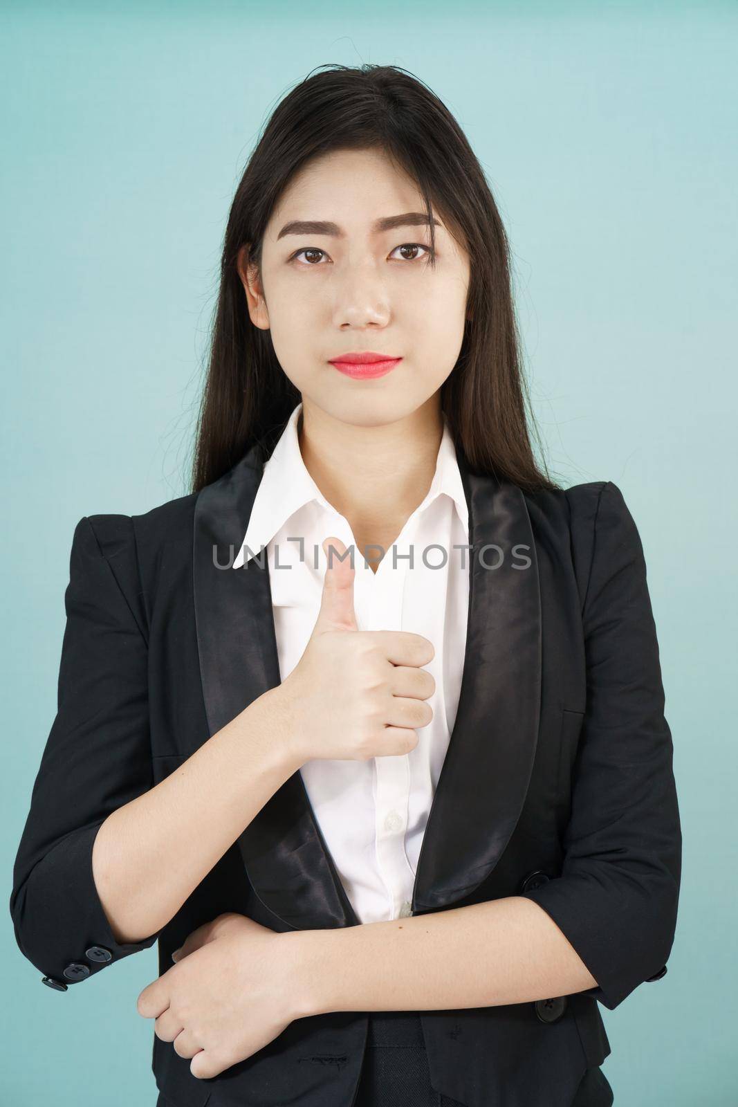 Asian business women in suit and thump up by stoonn