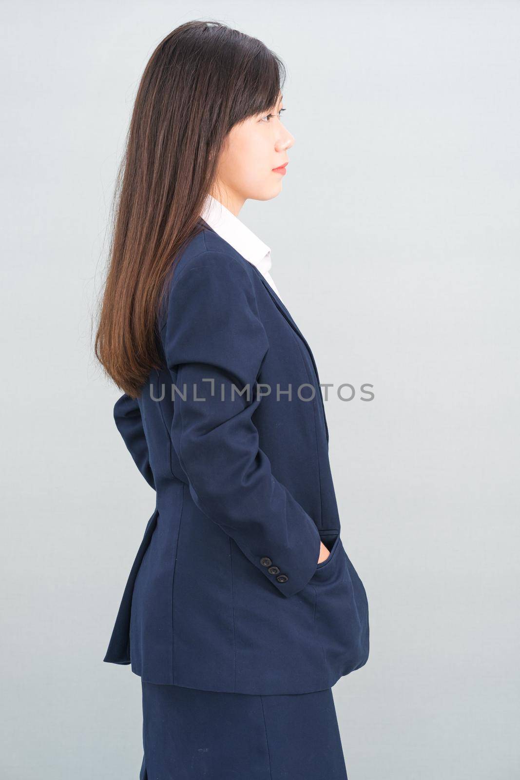 Portrait of asian businesswoman isolated on gray background